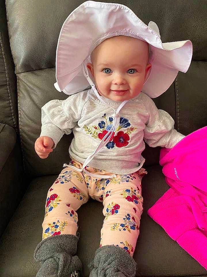 Keira is registered to the contest to win money with this photo: baby, baby_toddler_clothing, cheek, child, clothing, fashion_accessory, hat, headgear, person, pink, product, skin, sleeve, sun_hat, toddler