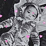 baby, infant, onesie, fuzzy_clothing, hood, lying_down, pink_hearts, monochrome, cute, calm, face, child, soft_texture, cozy, portrait, baby_clothes, adorable, small_child, warm, sleepwear