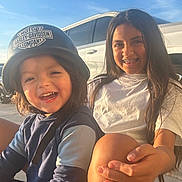 Samuel joined the competition — help win amazing prizes! child, helmet, smile, braces, outdoor, sunlight, happy, person, blue_sky, vehicle, white_car, casual_clothing, long_hair, joyful, sitting, daylight, face, young, motorcycle_helmet, friendship