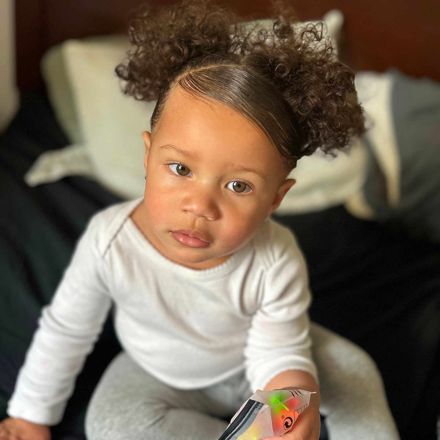 Alaysia is registered to the contest to win money with this photo: animal, baby, bodypart, couch, cushion, face, finger, furniture, hair, hand, happy, head, homedecor, indoors, person, photography, portrait, reading, sitting, smile