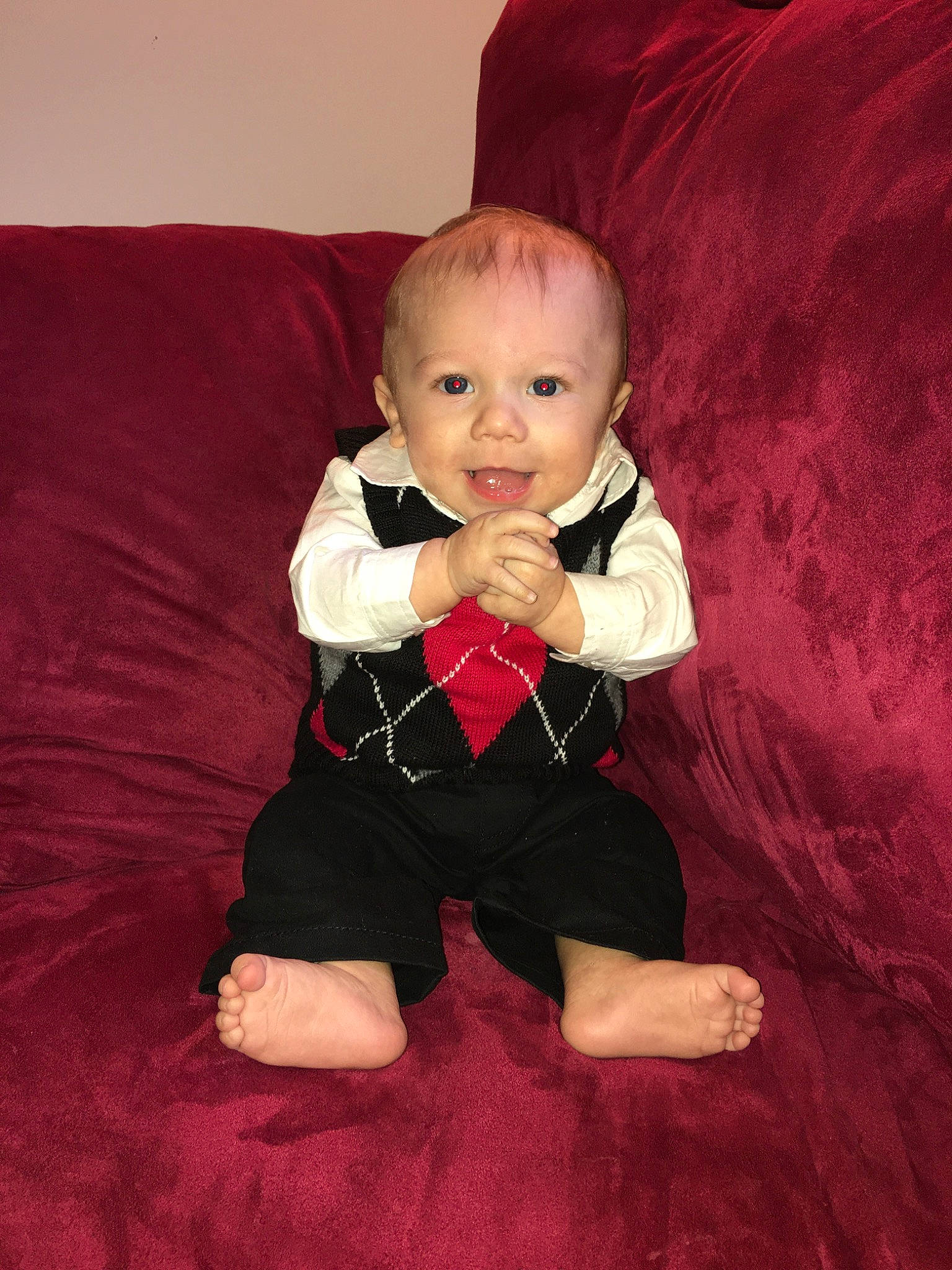 Camron is registered to the contest to win money with this photo: baby, cheek, child, finger, person, sitting, toddler