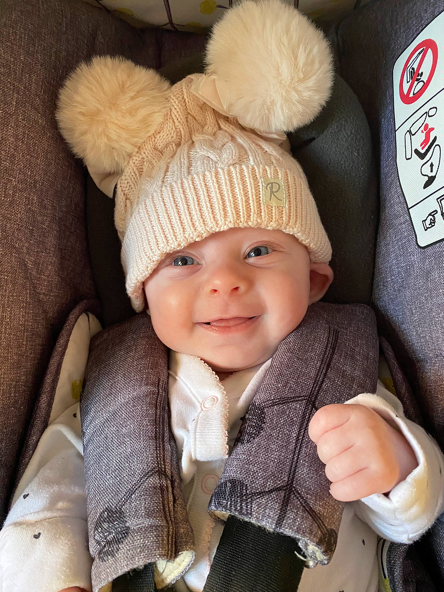 Amelia-grace is registered to the contest to win money with this photo: baby, baby_products, baby_toddler_clothing, cap, car_seat, cheek, child, costume_hat, face, happy, hat, head, headgear, headwear, joy, knit_cap, outerwear, person, skin, smile