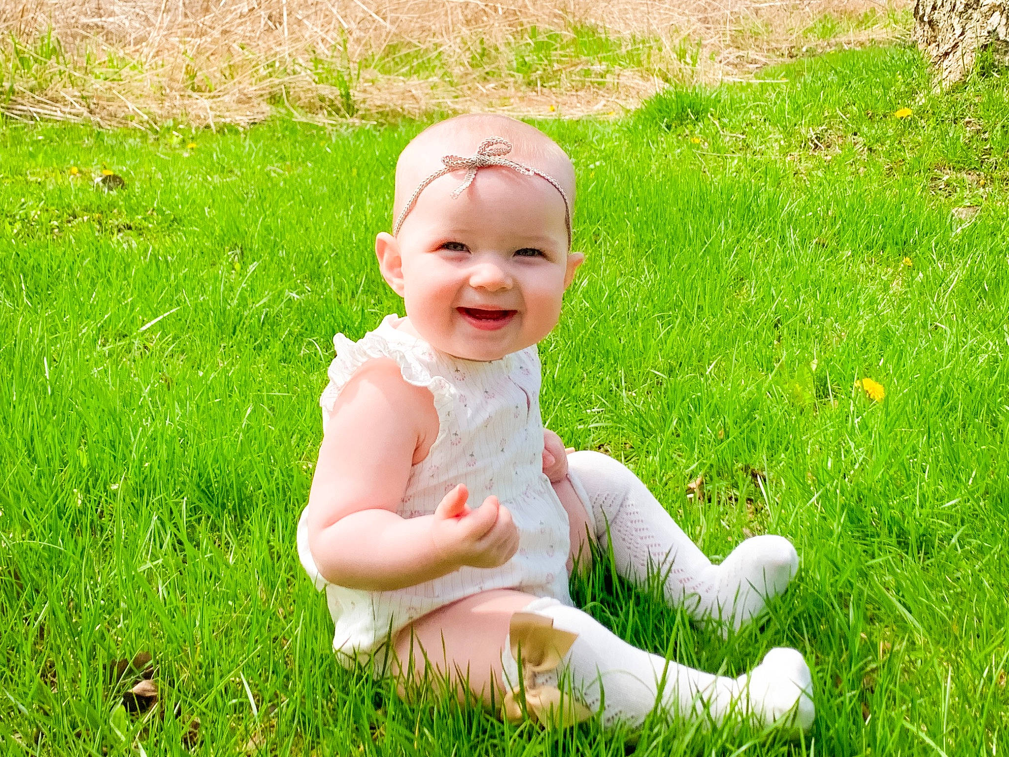 Charlotte joined the competition — help win amazing prizes! baby, baby_laughing, baby_toddler_clothing, child, fun, gesture, grass, grass_family, grassland, groundcover, happy, headwear, joy, lawn, meadow, people_in_nature, person, petal, plant, sitting