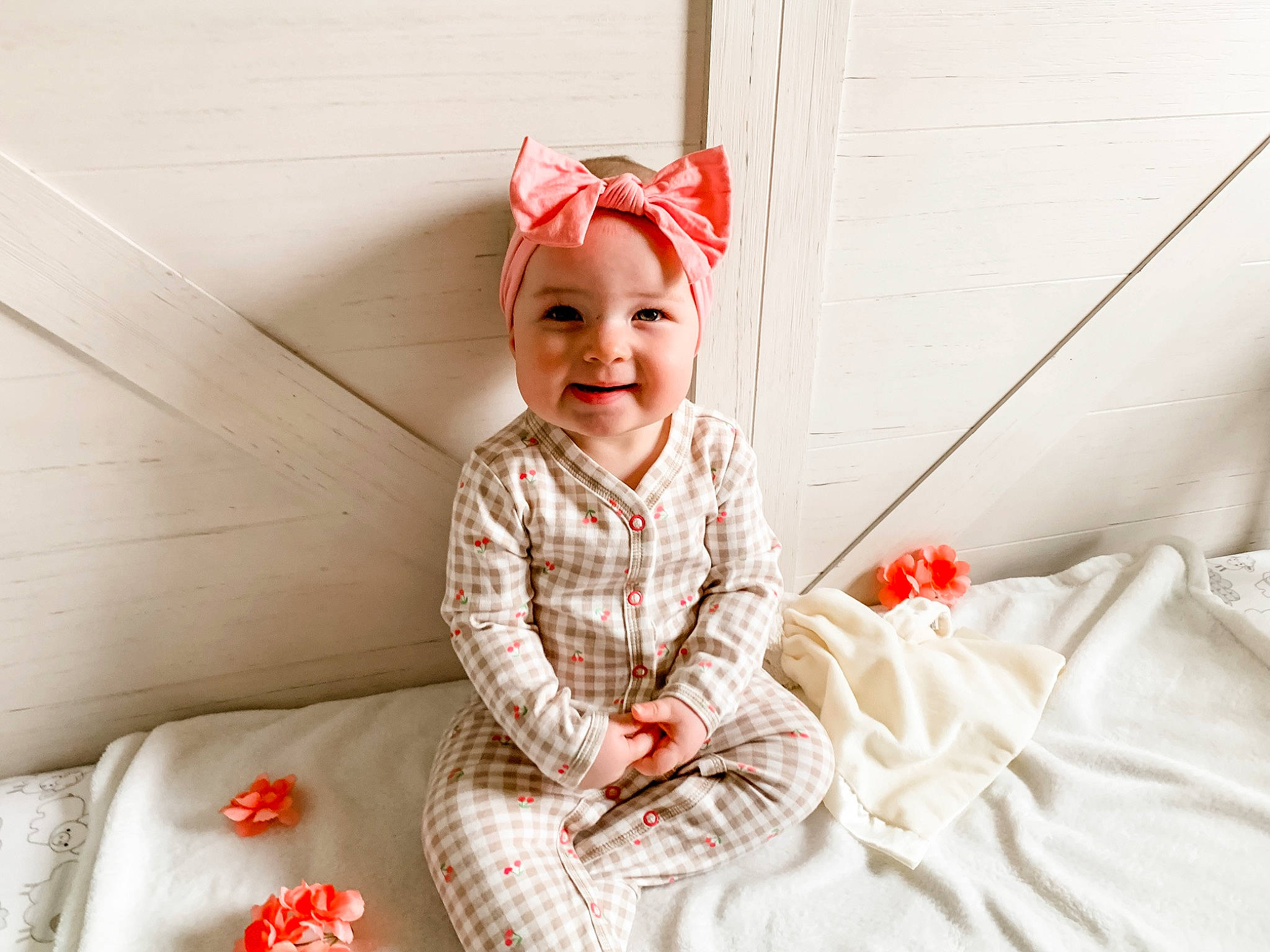 Charlotte joined the competition — help win amazing prizes! arm, baby, baby_toddler_clothing, child, comfort, dress, event, eye, face, fun, happy, head, headwear, human_body, joy, linens, peach, person, room, sitting