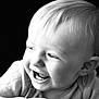 baby, smiling, laughing, black_and_white, portrait, infant, close_up, happy, child, cute, face, expression, young, person, skin, head, hair, clothing, background, emotion