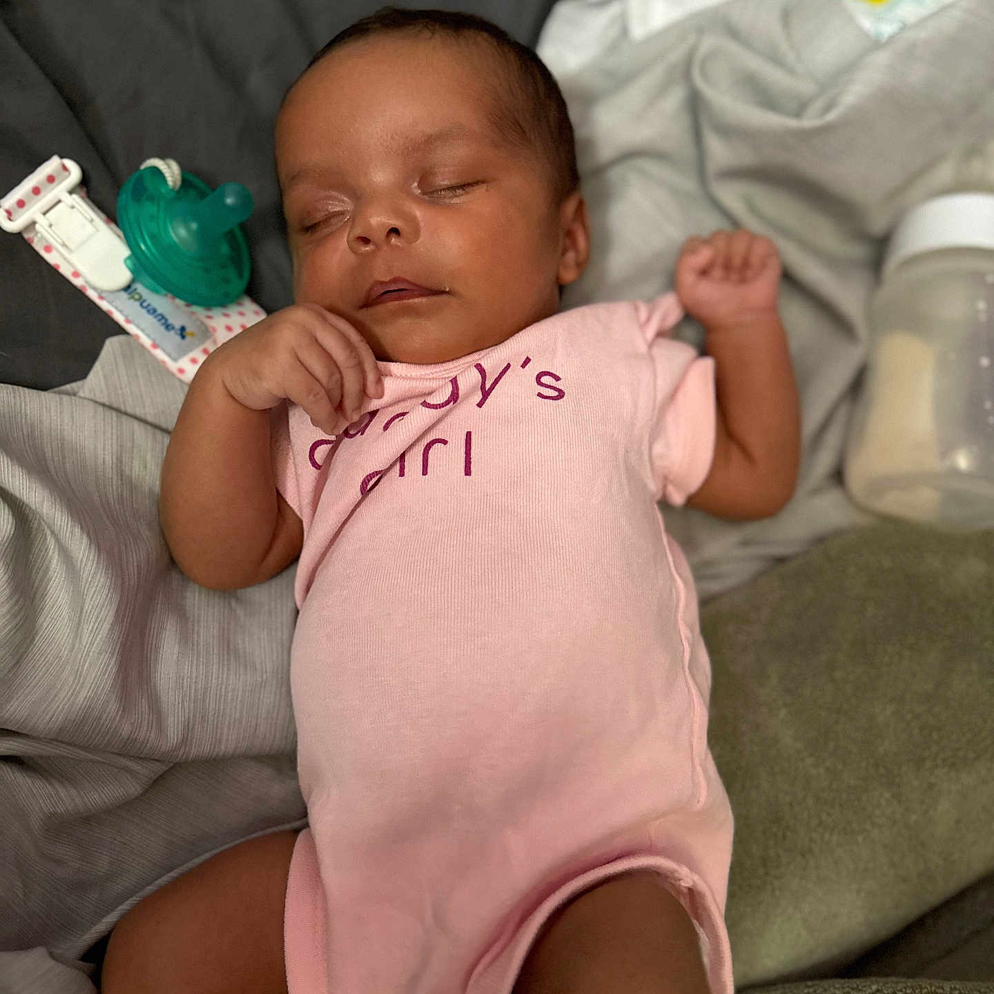 Malaina joined the competition — help win amazing prizes! baby, baby_bottle, bed, blanket, child, cute, human, indoor, infant, newborn, onesie, pacifier, peaceful, pink_clothing, portrait, relaxing, resting, sleeping, soft_fabric, toddler