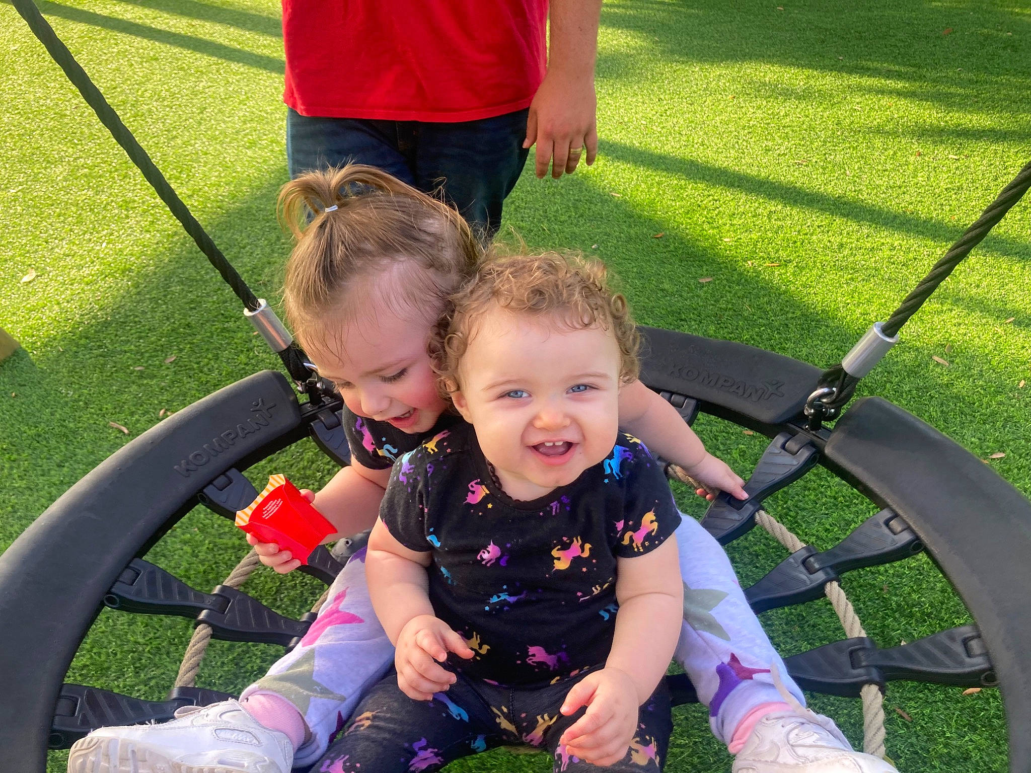 Hayden joined the competition — help win amazing prizes! baby, fun, grass, grass_family, green, happy, lap, lawn, leaf, leisure, person, plant, recreation, shoe, shorts, smile, sneakers, swing, toddler, wheel