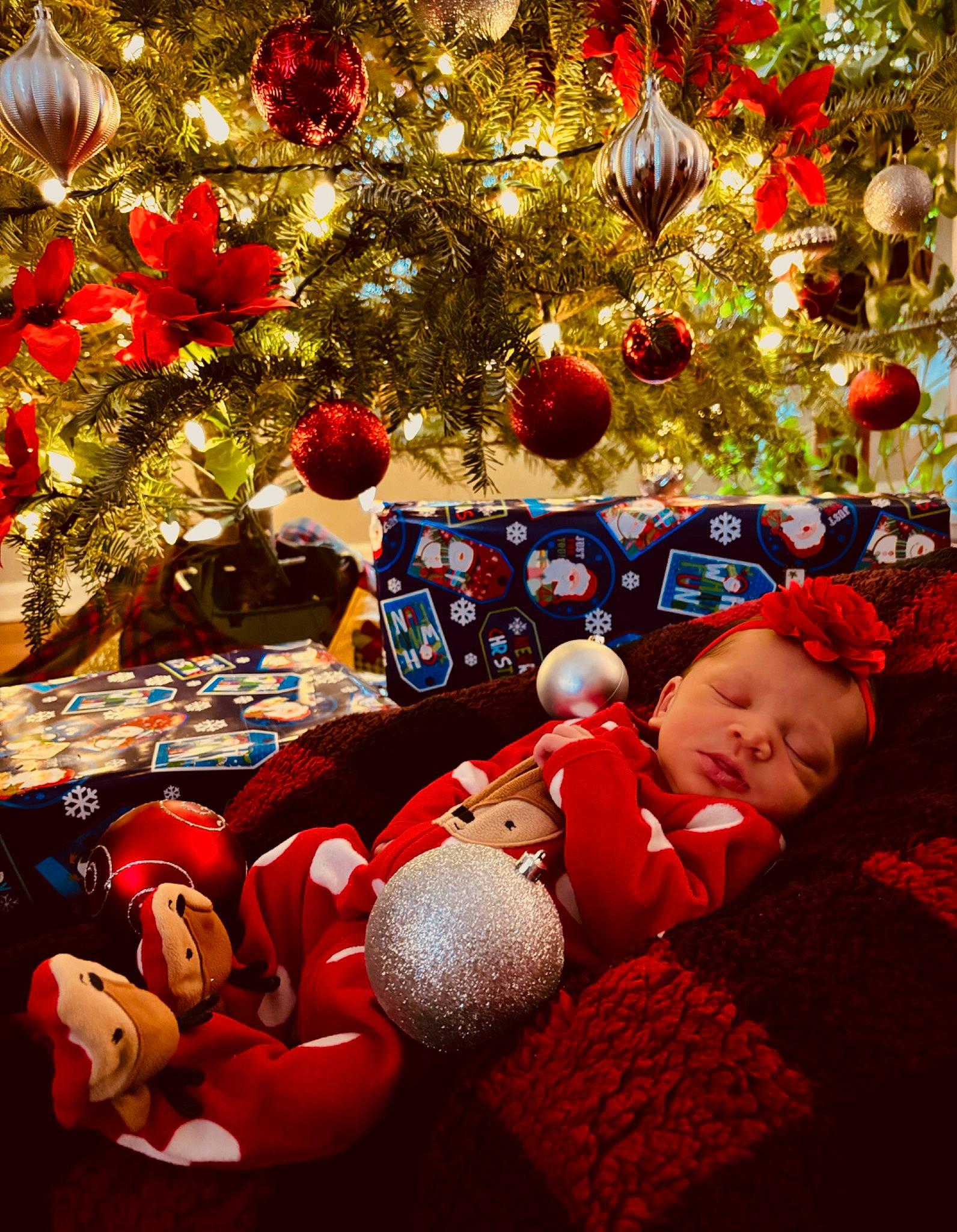 Nevaeh is registered to the contest to win money with this photo: baby, carmine, christmas, christmas_decoration, christmas_eve, christmas_ornament, christmas_tree, decoration, event, flooring, fun, happy, holiday, holiday_ornament, ornament, person, plant, red, toddler, tradition