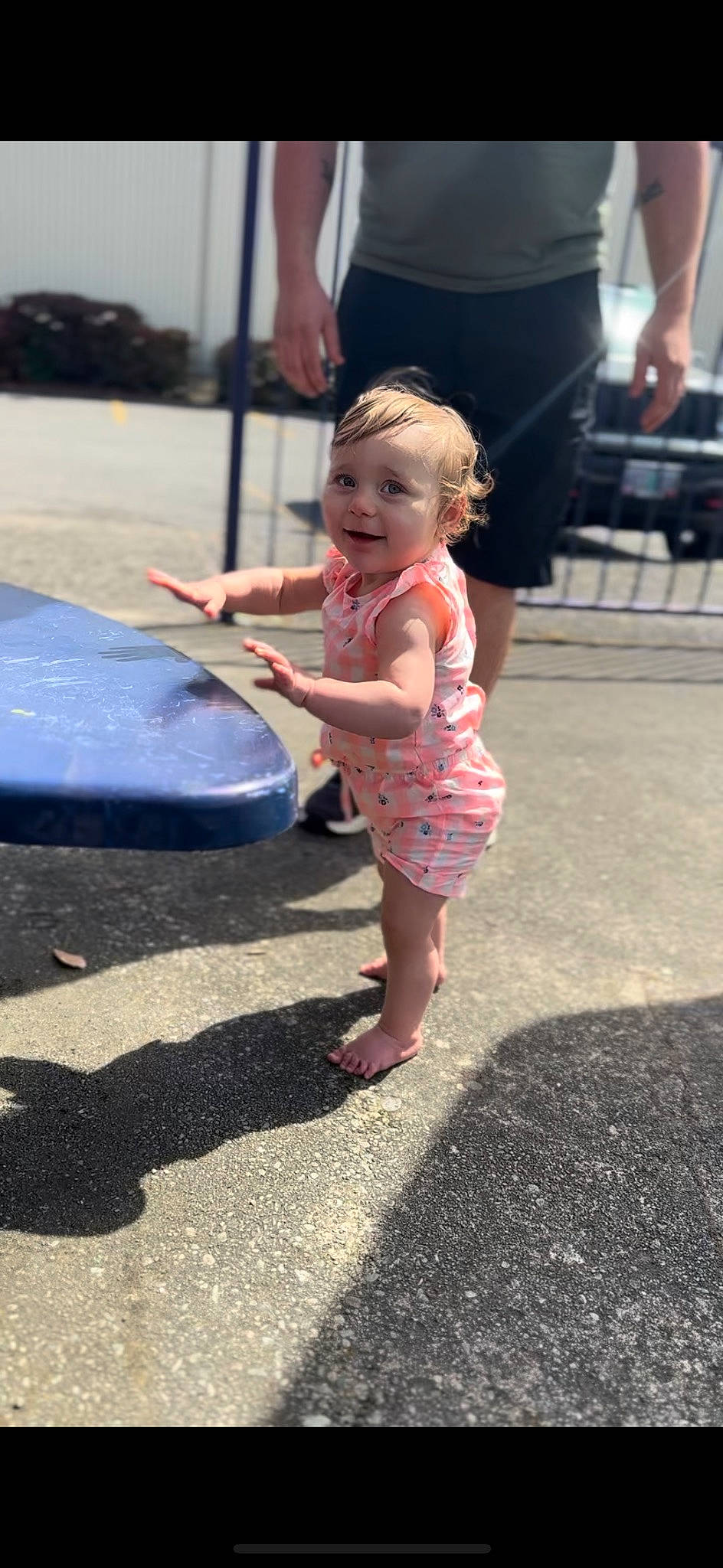 Adalynn is registered to the contest to win money with this photo: asphalt, baby, child, city, dress, foot, fun, grass, headwear, human_leg, joy, leg, leisure, pedestrian, person, pink, recreation, road, road_surface, sandal
