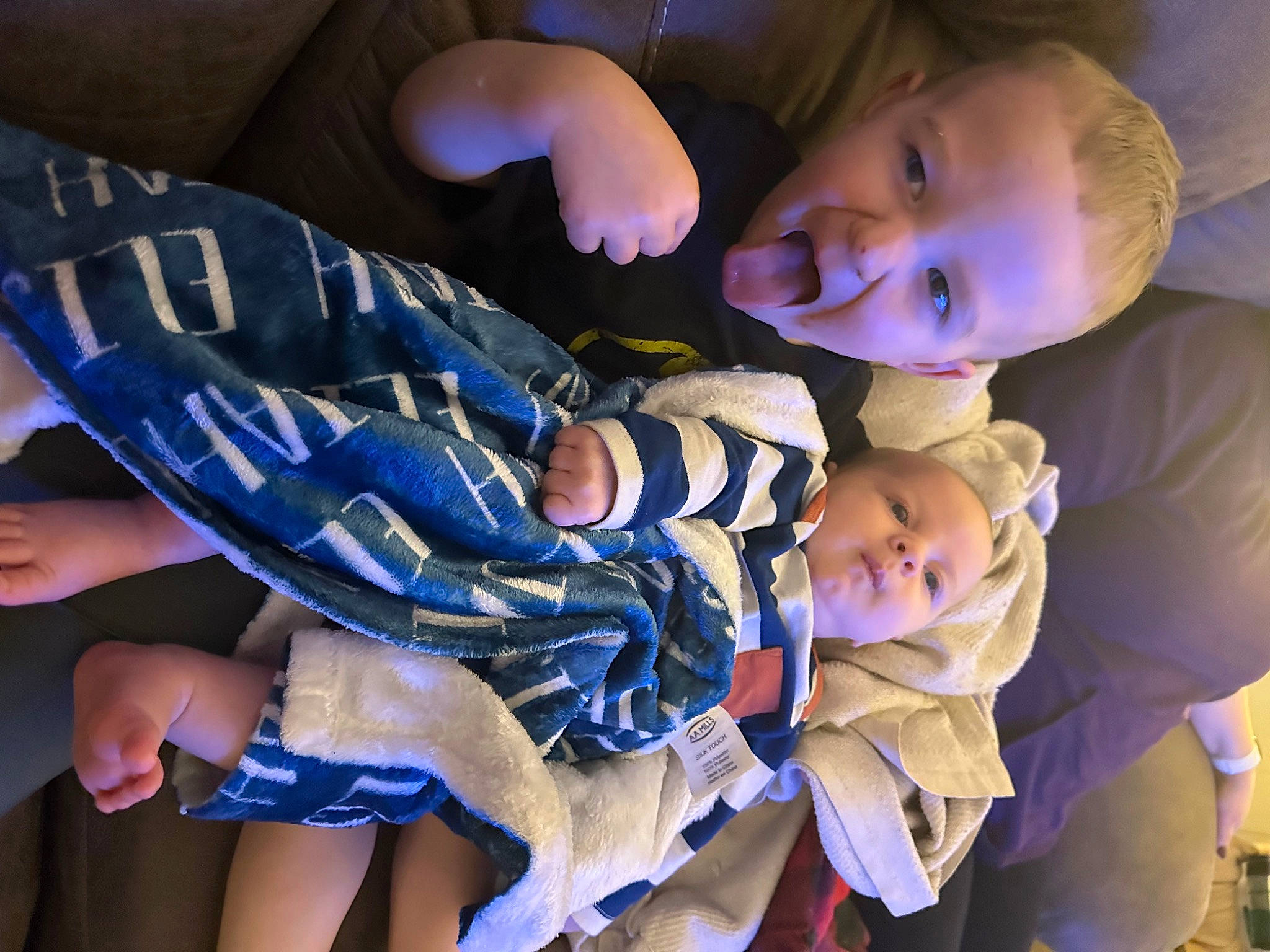 Daxton is registered to the contest to win money with this photo: baby, baby_toddler_clothing, blue, cheek, child, electric_blue, event, eye, finger, flash_photography, fun, gesture, hand, happy, human_body, person, plant, purple, smile, toddler