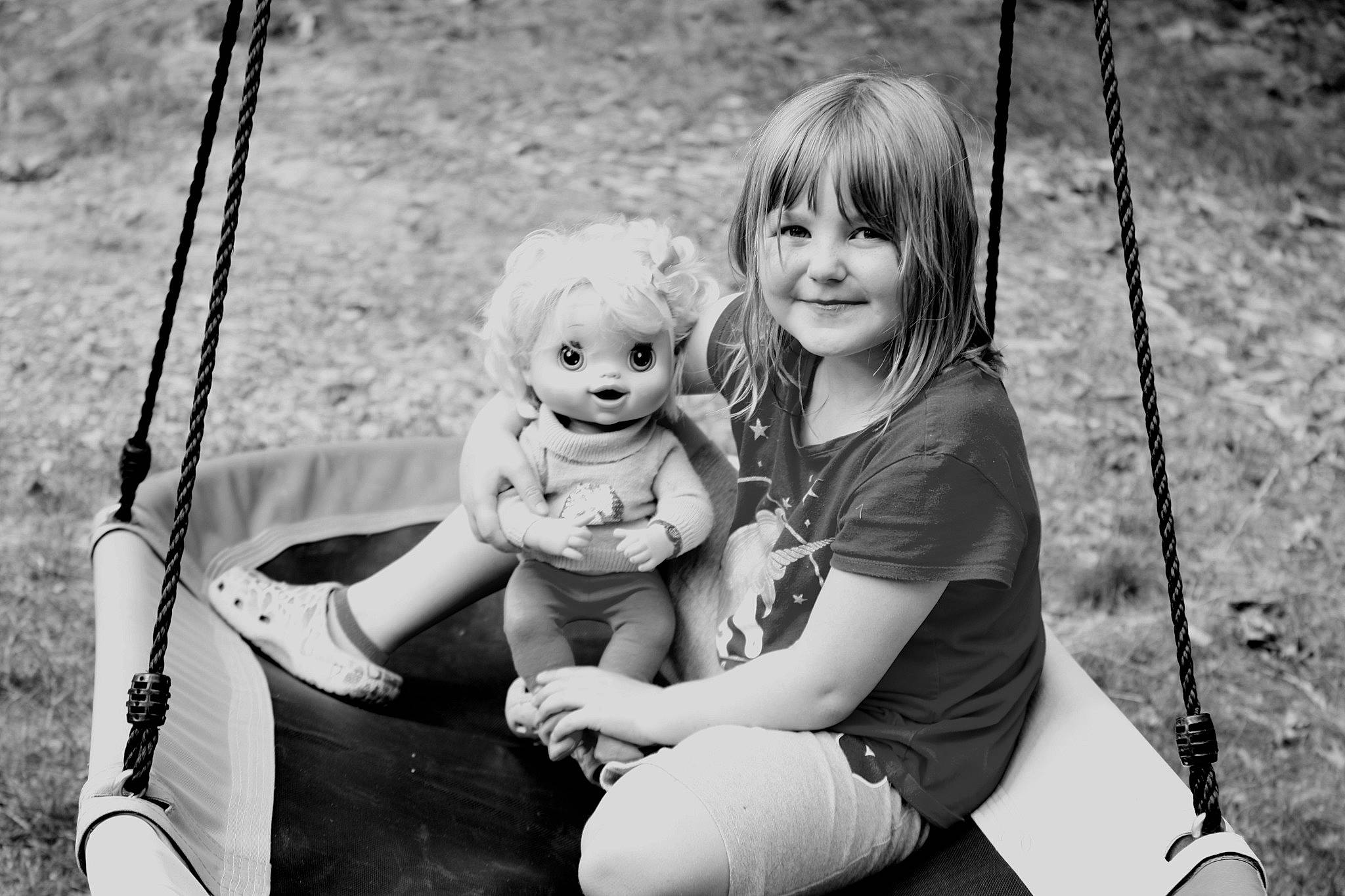 Lillian joined the competition — help win amazing prizes! arm, black, black_and_white, eye, flash_photography, grass, hand, happy, joy, leg, leisure, people_in_nature, person, photograph, playground, shorts, skin, smile, style, swing