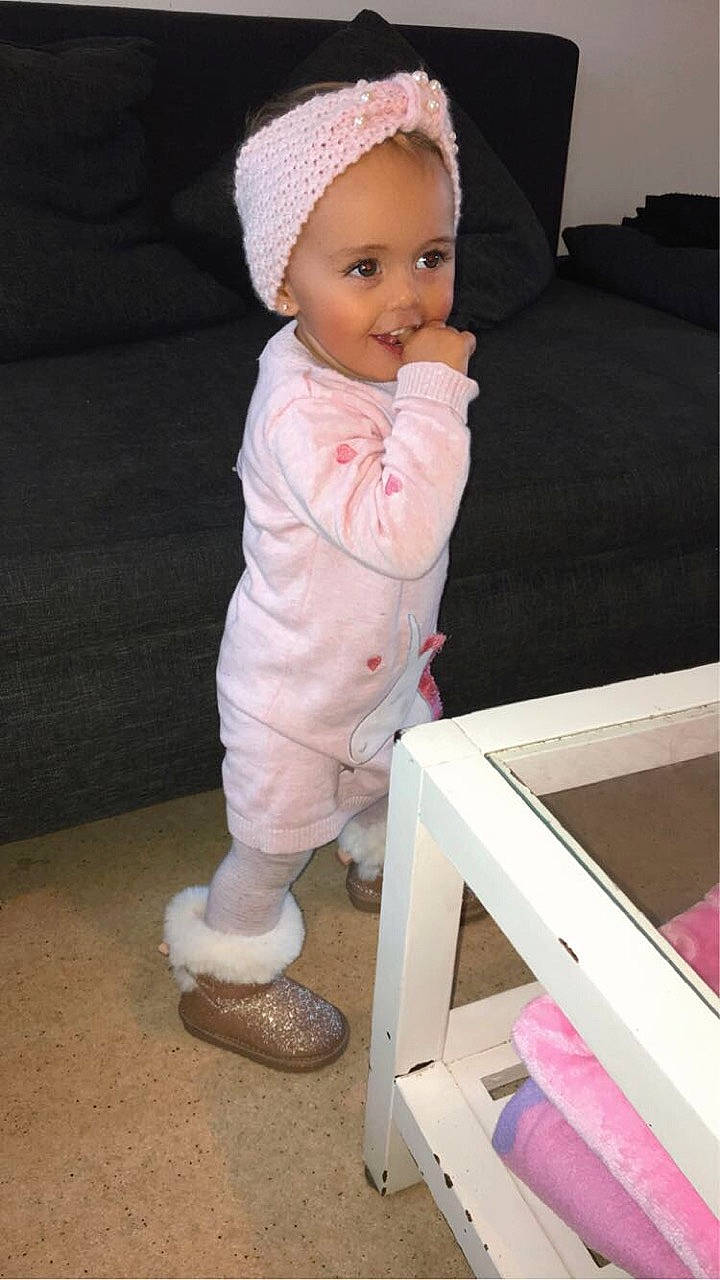 Liyana participe au concours pour gagner de l'argent avec cette photo : baby, baby_products, baby_toddler_clothing, beanie, bonnet, cap, child, headgear, joy, knit_cap, outerwear, person, pink, product, toddler