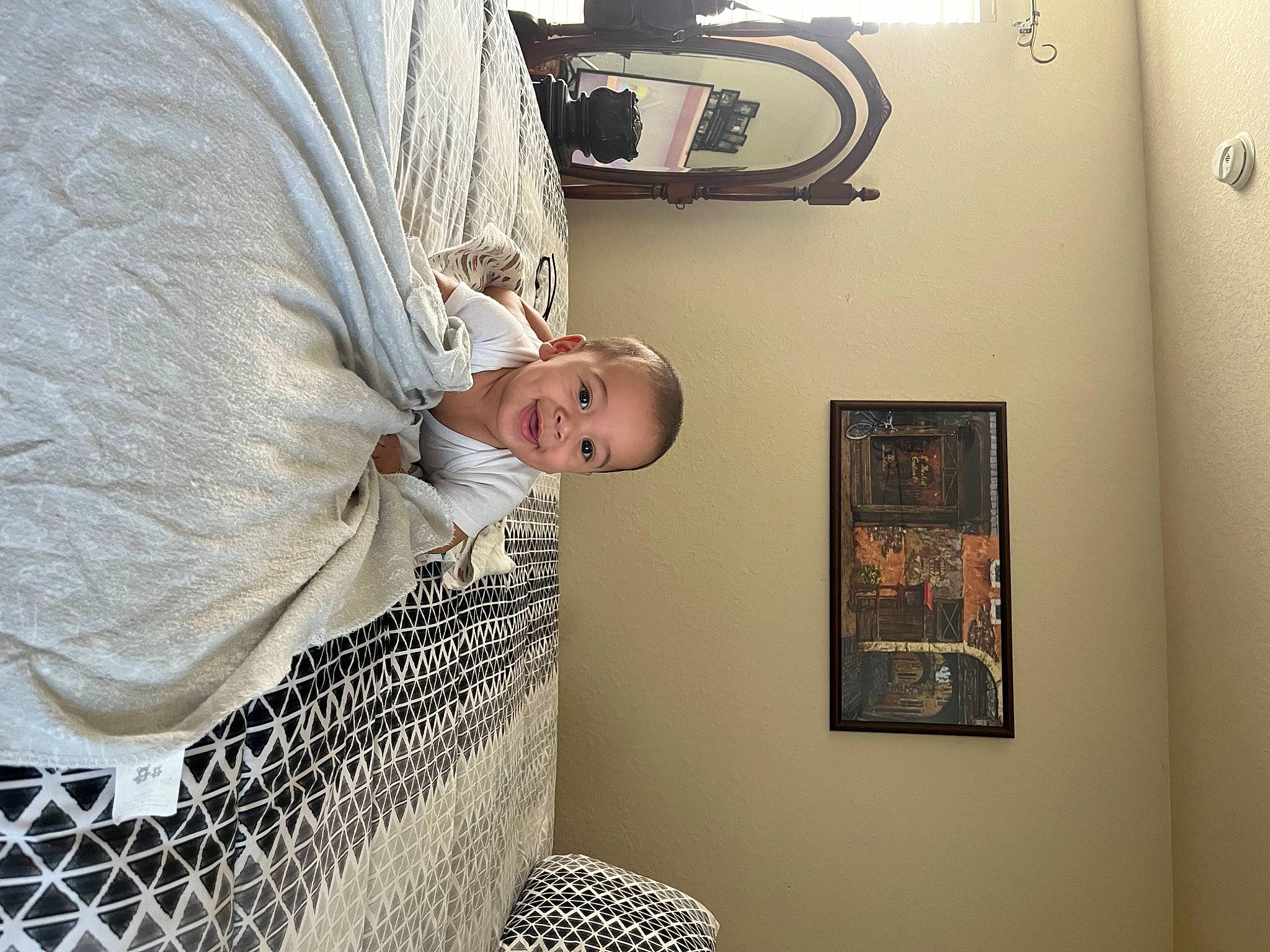 Liam is registered to the contest to win money with this photo: baby_products, ceiling, comfort, fashion_accessory, flooring, fur, joy, linens, mesh, net, pattern, person, picture_frame, room, textile, umbrella, visual_arts, wicker, wood, wool