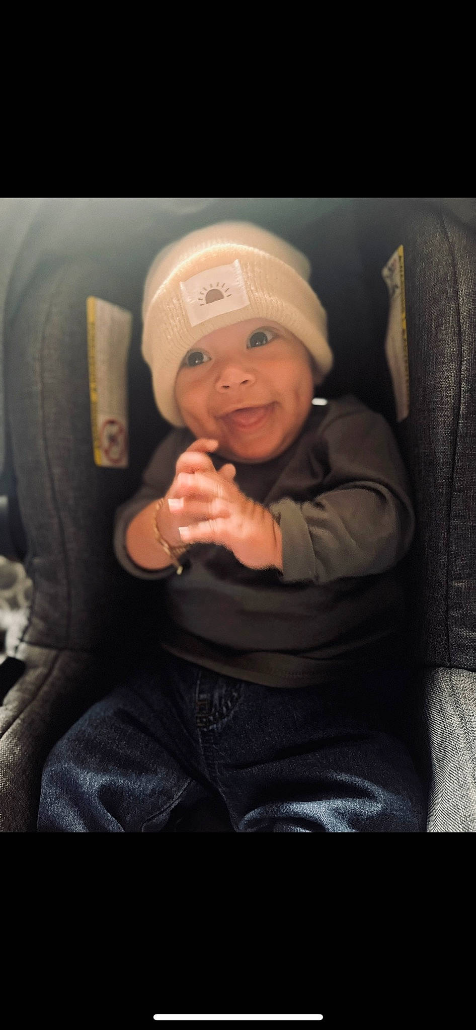 Liam joined the competition — help win amazing prizes! baby, baby_toddler_clothing, baseball_cap, cap, car_seat, cheek, child, comfort, eye, flash_photography, happy, hat, head, headgear, headwear, helmet, lap, person, personal_protective_equipment, smile