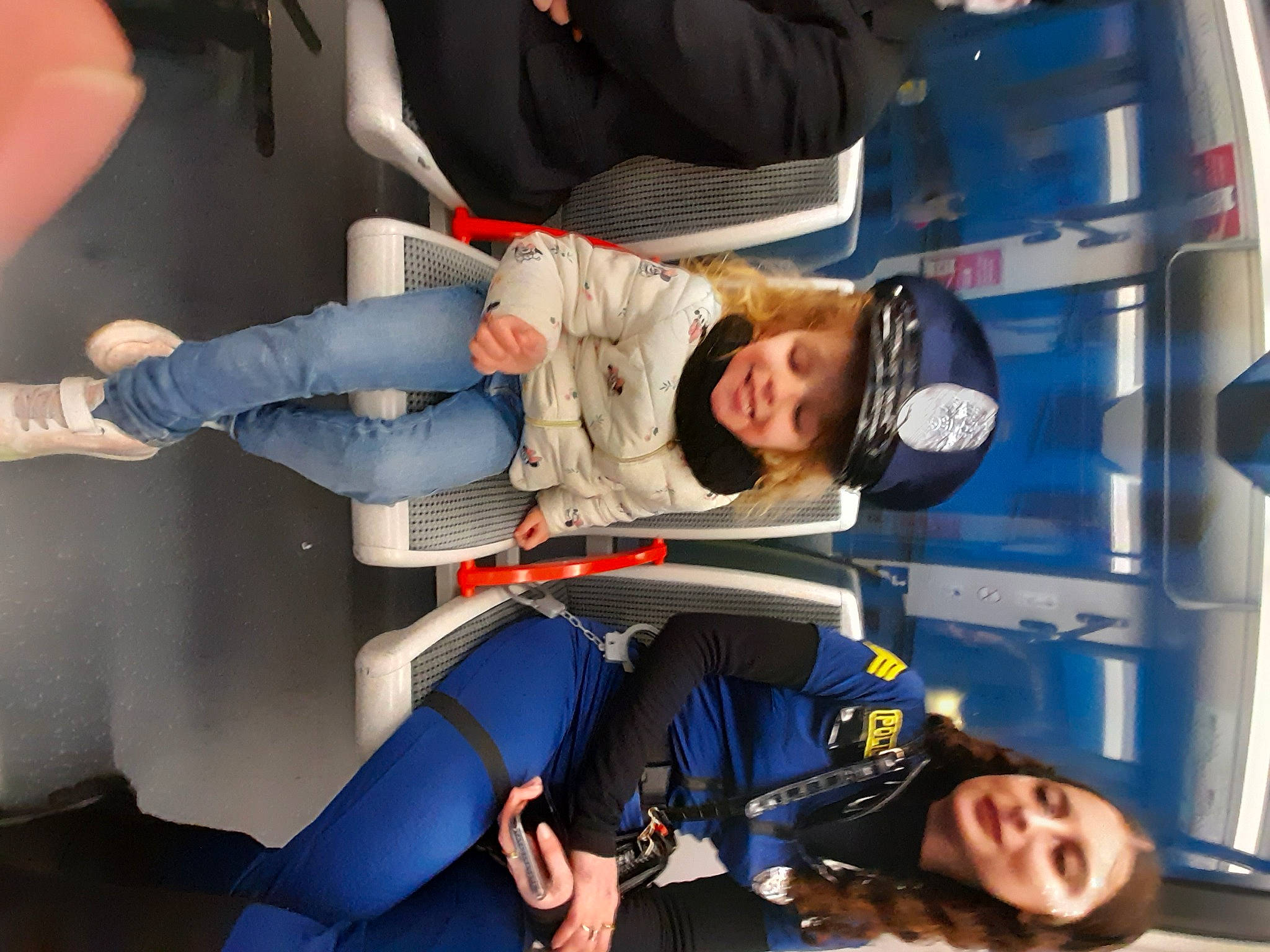 Zélie participe au concours pour gagner de l'argent avec cette photo : automotive_design, child, comfort, costume, electric_blue, fictional_character, fun, glove, headwear, human_leg, joy, knee, person, personal_protective_equipment, service, smile, thigh, travel, uniform