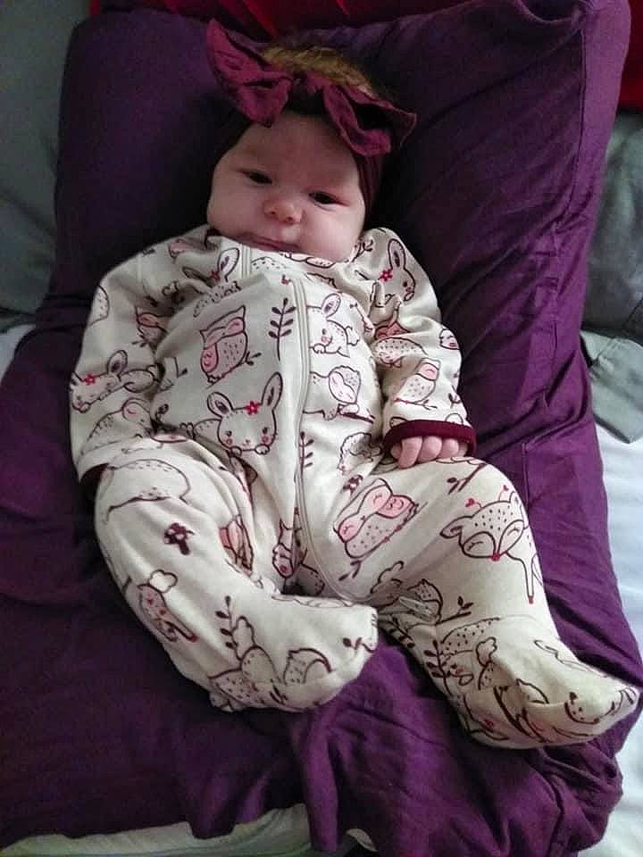 Stori joined the competition — help win amazing prizes! baby, baby_toddler_clothing, comfort, eye, headgear, headwear, human_body, human_leg, knee, linens, lip, magenta, pattern, person, pink, purple, sitting, skin, sleeve, thigh