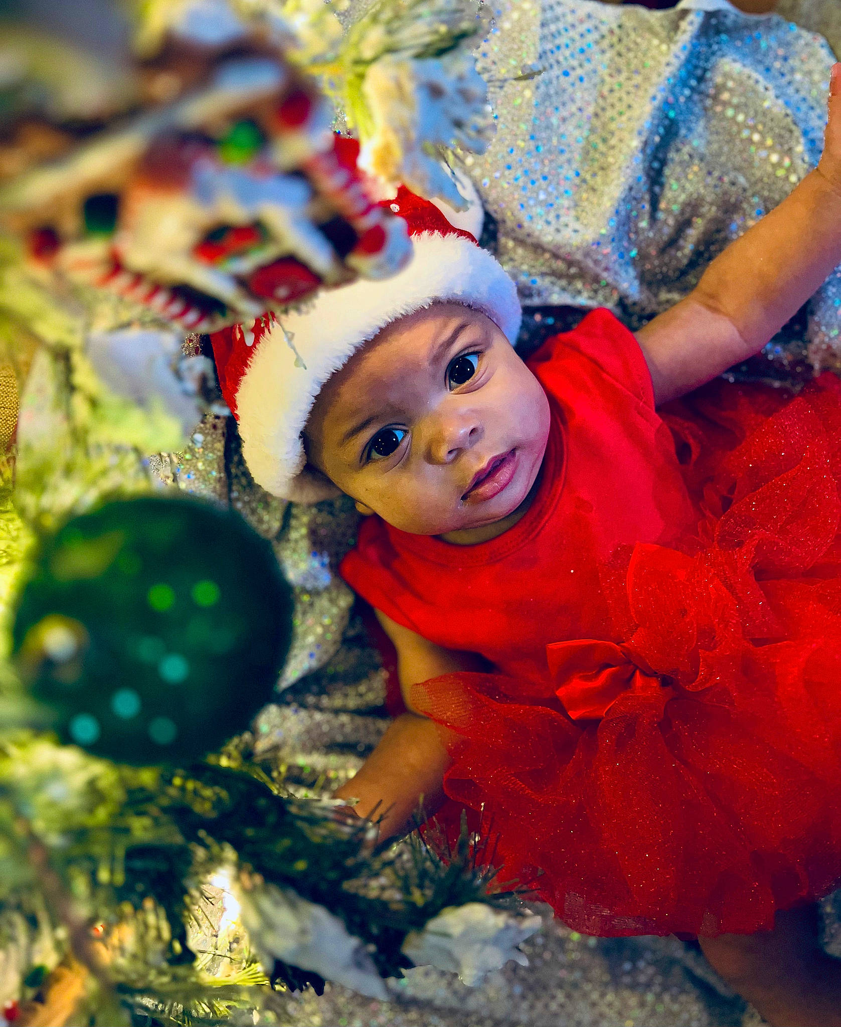 Gia joined the competition — help win amazing prizes! baby, baby_toddler_clothing, child, christmas_decoration, christmas_eve, christmas_ornament, christmas_tree, electric_blue, event, fun, happy, headwear, holiday, holiday_ornament, ornament, people_in_nature, person, play, toddler, tradition