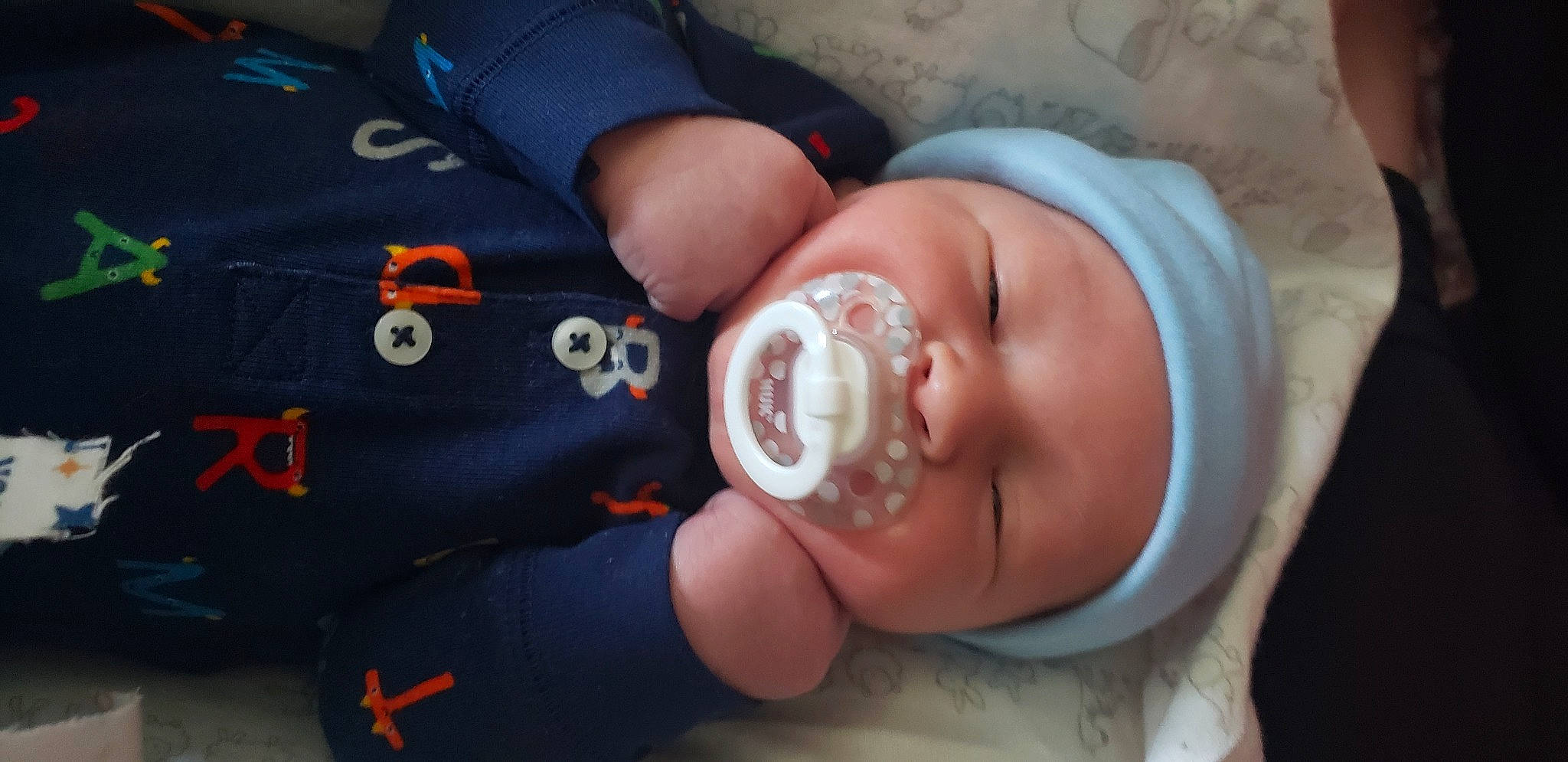 Riley is registered to the contest to win money with this photo: baby, birth, cheek, child, ear, headwear, leg, person, sleep, toddler