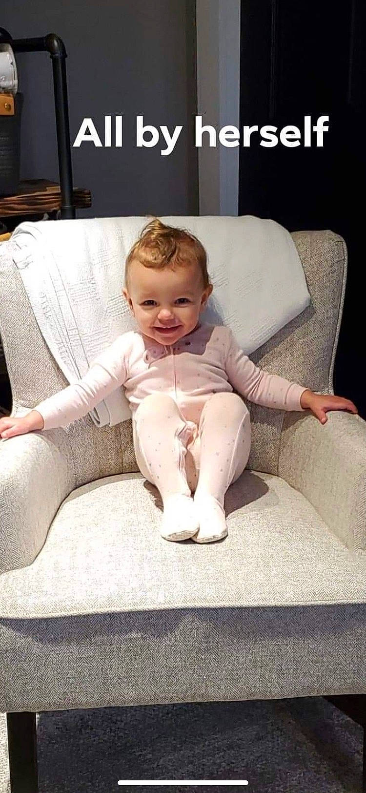 Adilynn is registered to the contest to win money with this photo: baby, car_seat, comfort, cool, couch, eye, face, finger, foot, hair, happy, head, human_leg, joy, knee, lap, leg, person, sleeve, smile