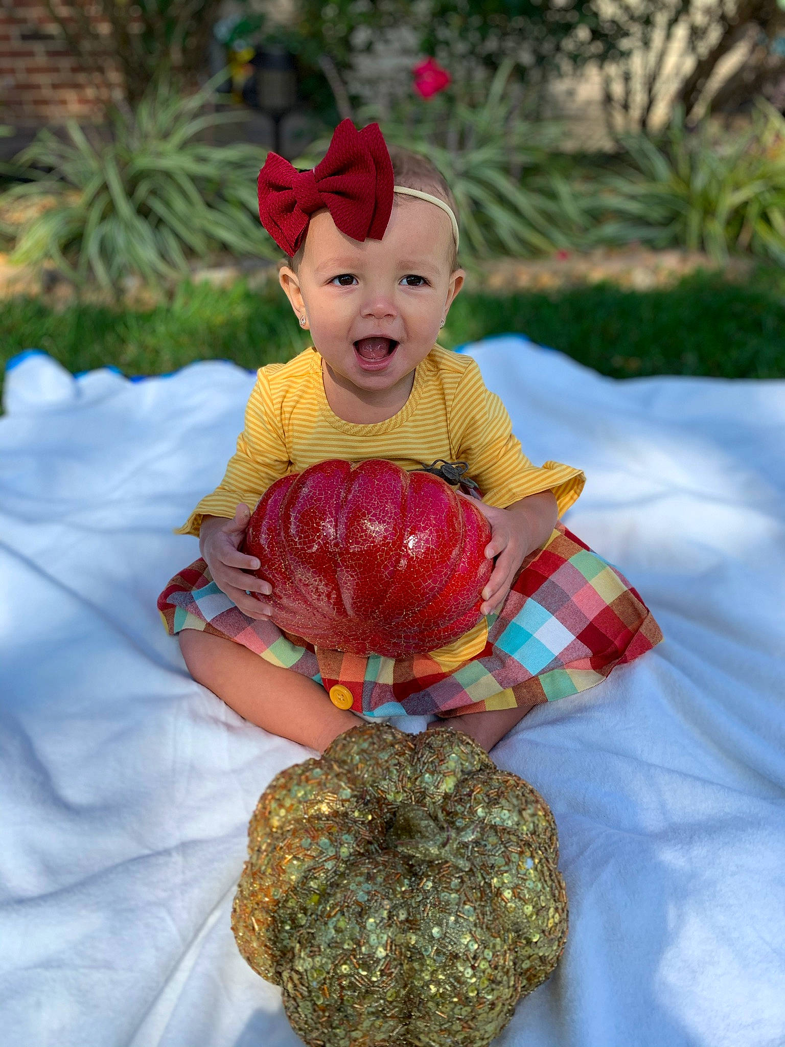 Adilynn joined the competition — help win amazing prizes! art, baby_toddler_clothing, botany, calabaza, event, eye, gourd, happy, hat, human_body, leisure, person, plaid, plant, pumpkin, tartan, textile, toddler, toy, tradition