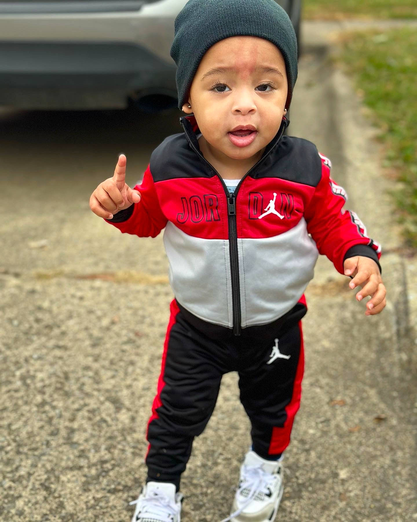 Jaceon is registered to the contest to win money with this photo: baby, baby_toddler_clothing, ball, cap, child, eye, face, fun, gesture, grass, happy, headwear, jacket, person, personal_protective_equipment, photograph, play, recreation, sleeve, sports_equipment