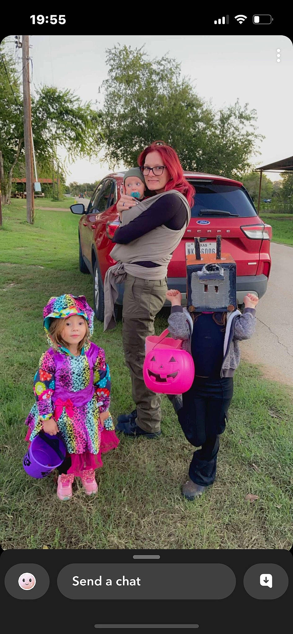 Claira is registered to the contest to win money with this photo: car, fun, grass, happy, headwear, jeans, joy, land_vehicle, leisure, motor_vehicle, person, pink, plant, recreation, shoe, smile, tire, toddler, tree, trousers