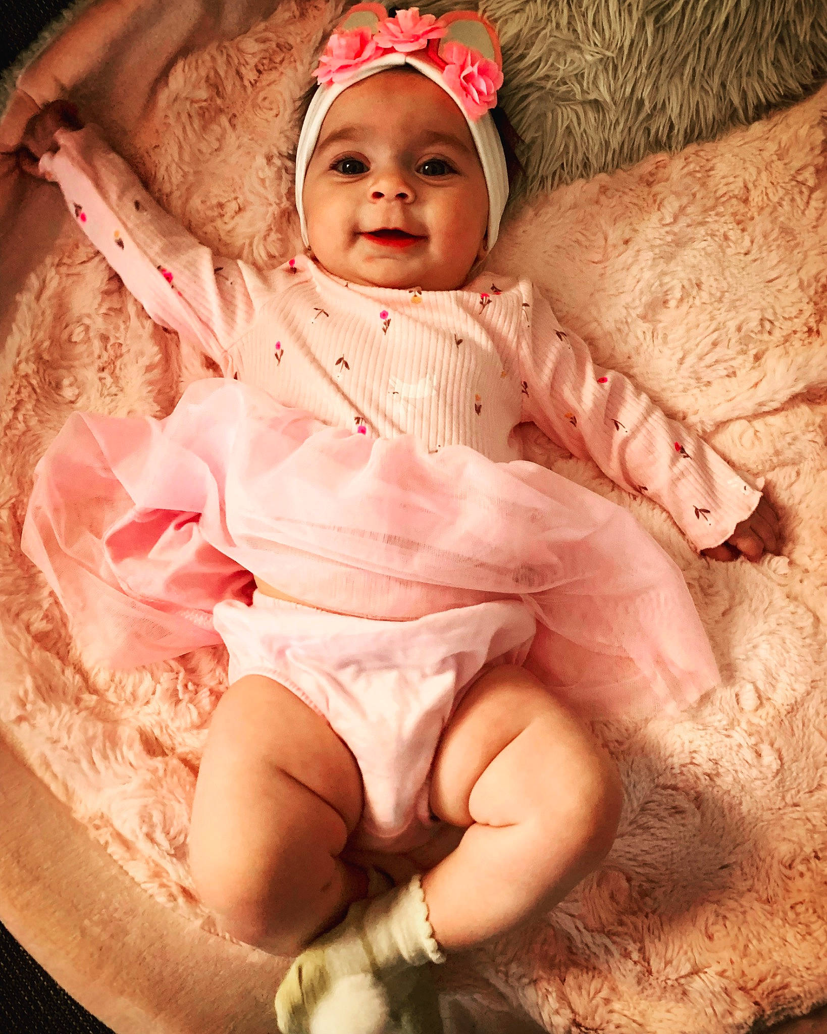 Aubrielle Rose is registered to the contest to win money with this photo: arm, baby, baby_toddler_clothing, cap, cheek, comfort, dress, eye, face, hand, head, headgear, headwear, human_body, leg, lip, mouth, person, pink, skin