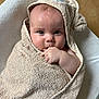 baby, towel, hood, bear_ears, hand, fingers, face, skin, curious, child, infant, wrapped, cushion, white, floor, tile, cute, indoors, portrait, soft