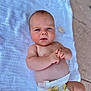 Kayce participe au concours pour gagner de l'argent avec cette photo : baby, infant, diaper, blanket, outdoor, person, skin, face, hands, expression, curious, lying_down, closeup, child, young, newborn, natural_light, soft_texture, candid, portrait