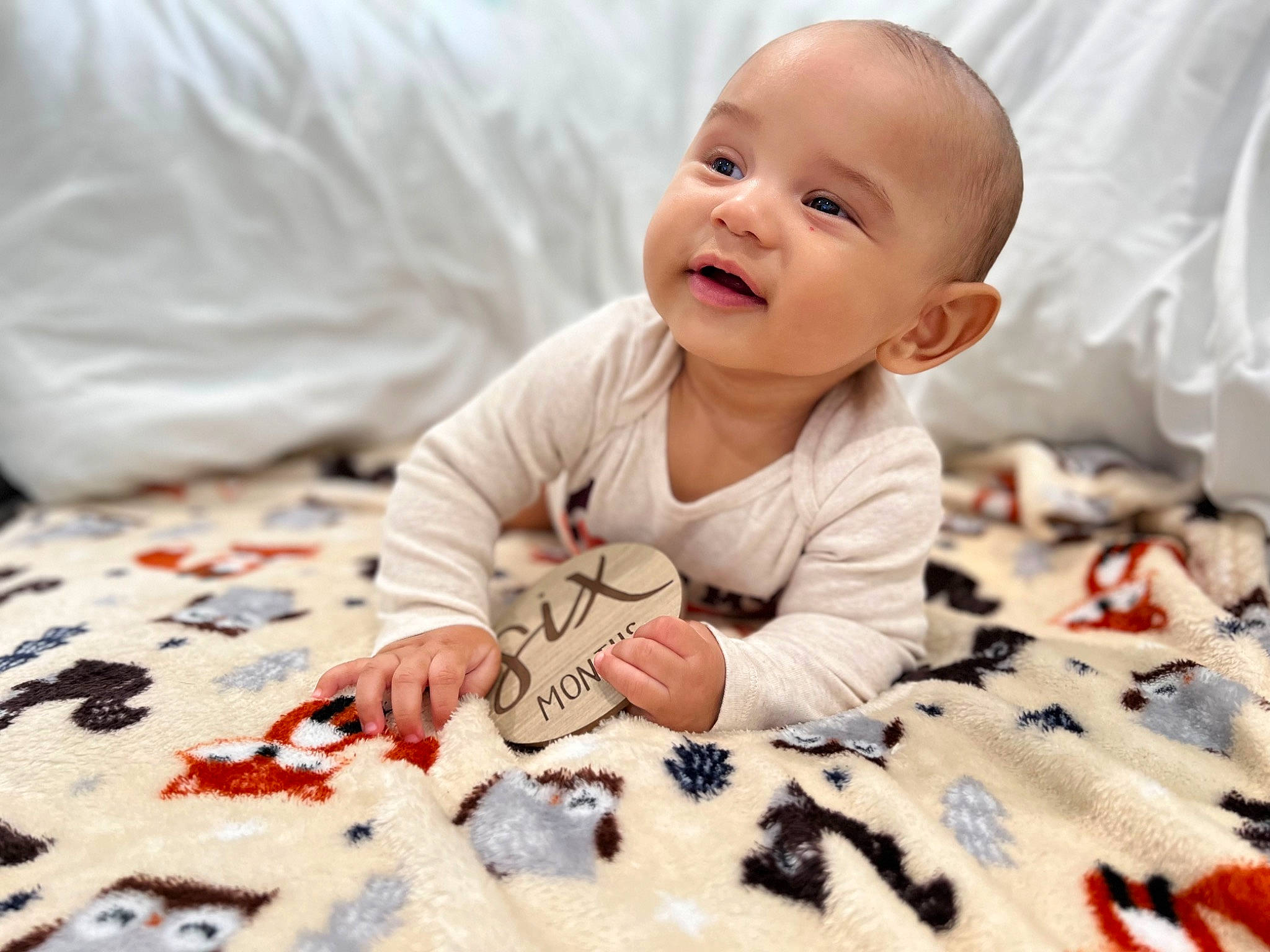 Kyree joined the competition — help win amazing prizes! art, baby, baby_toddler_clothing, bedding, cheek, child, comfort, dress, floor, flooring, happy, linens, orange, pattern, person, skin, sleeve, smile, textile, toddler