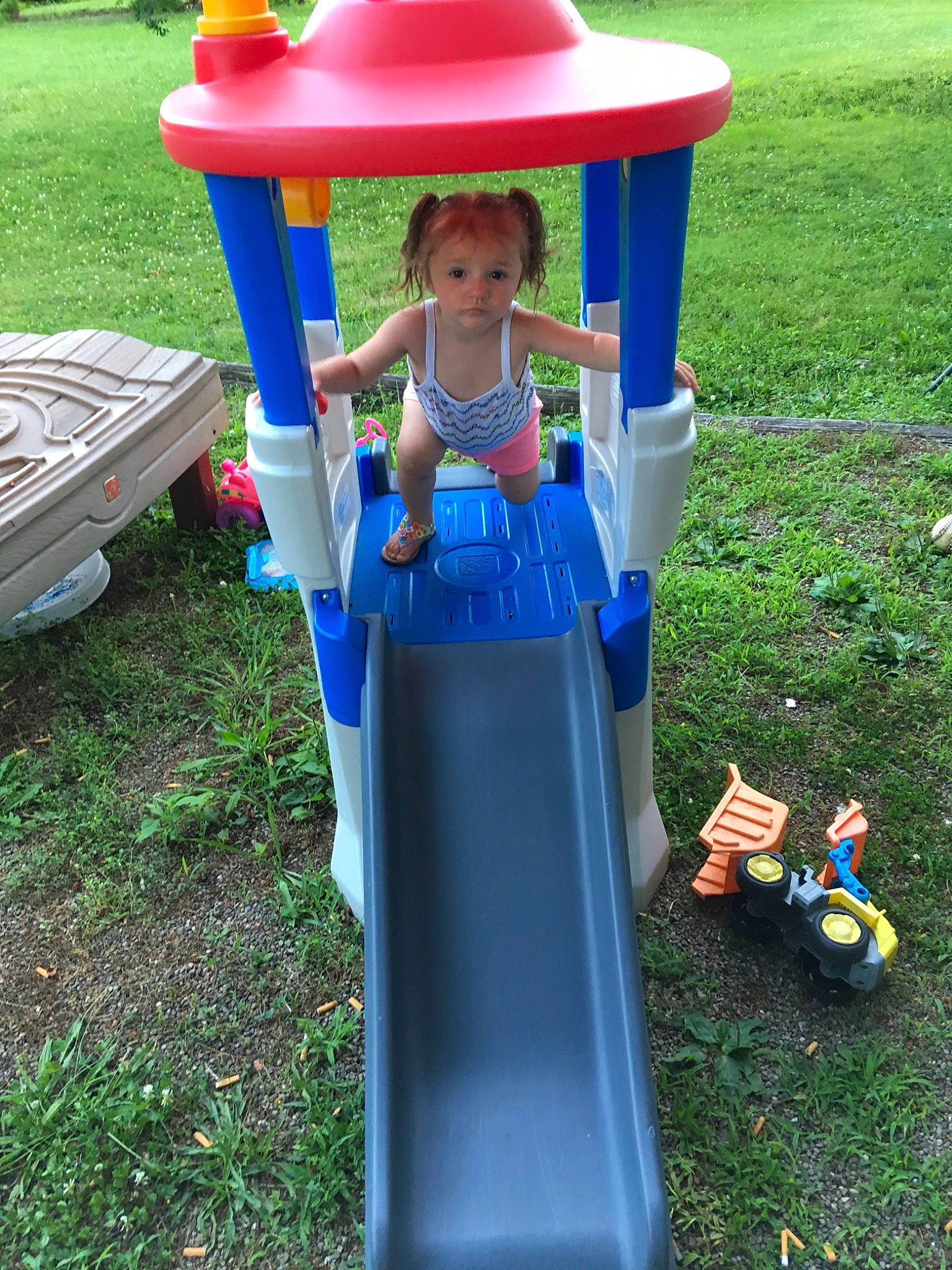 Braylynn joined the competition — help win amazing prizes! backyard, child, chute, fun, grass, human_settlement, leisure, outdoor_play_equipment, person, plastic, play, playground, playset, public_space, recreation, toddler, toy