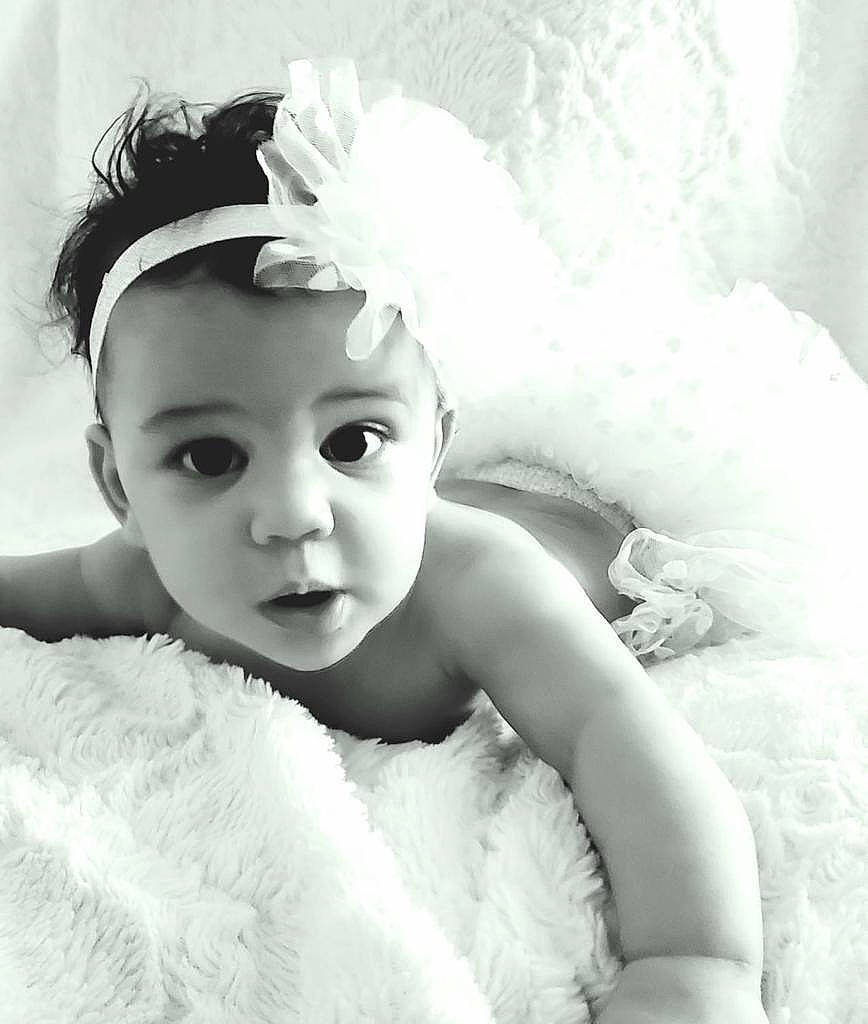 Mira is registered to the contest to win money with this photo: baby, beauty, black_and_white, child, dress, eye, face, hair_accessory, headgear, headpiece, monochrome, monochrome_photography, person, photo_shoot, photograph, photography, skin, smile, stock_photography, toddler