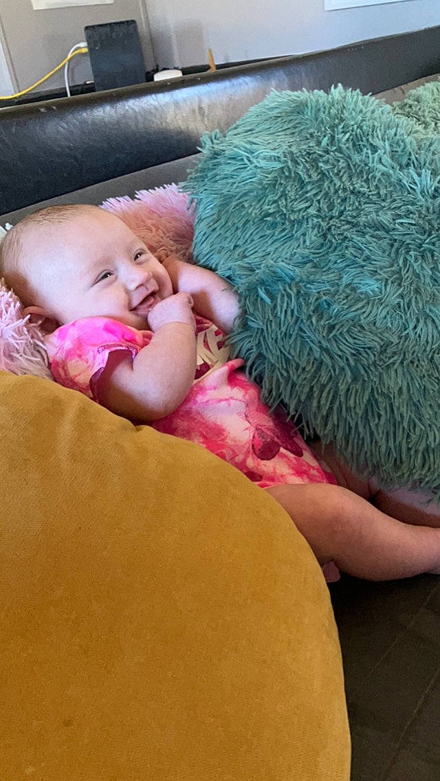 Jessica is registered to the contest to win money with this photo: baby, baby_products, baby_sleeping, bedding, bedtime, child, comfort, finger, flooring, fur, human_body, linens, magenta, nap, person, pink, room, sleep, thread, toddler