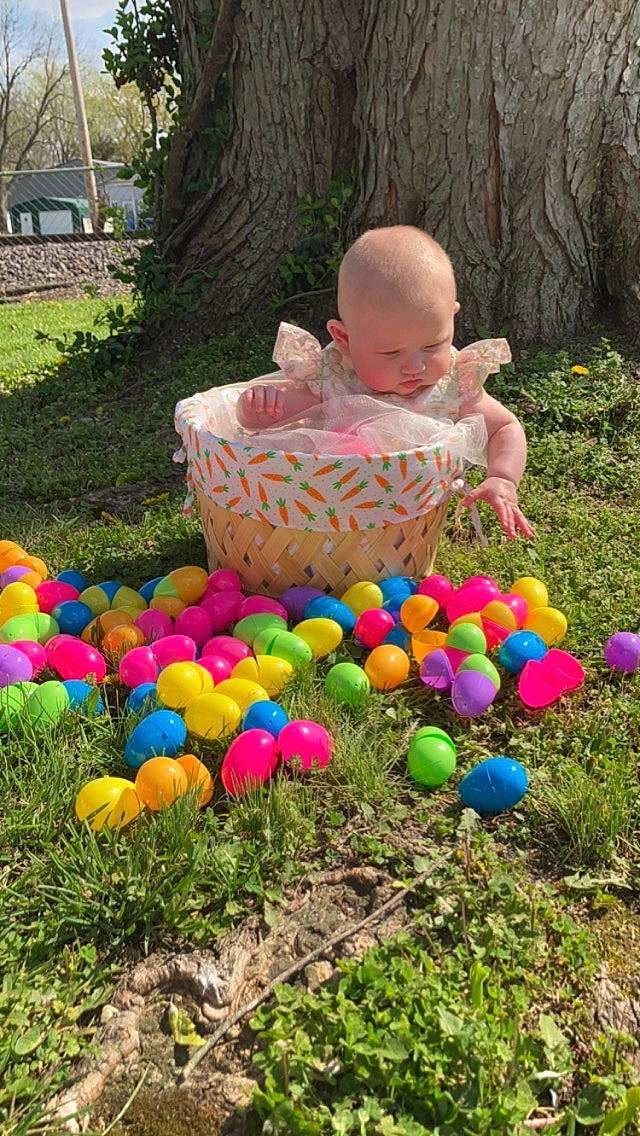 Jessica is registered to the contest to win money with this photo: baby, baby_toddler_clothing, balloon, event, fun, grass, grass_family, lawn, leisure, nature, party_supply, people_in_nature, person, pink, plant, public_space, recreation, summer, toddler, toy