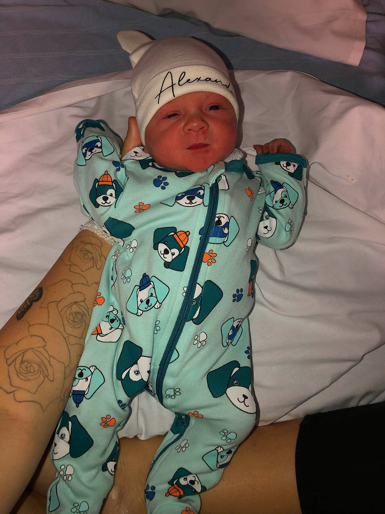 Alexander is registered to the contest to win money with this photo: baby, baby_toddler_clothing, cap, child, comfort, elbow, face, fun, happy, headwear, human_leg, linens, pattern, person, sitting, skin, sleeve, t_shirt, textile, thigh