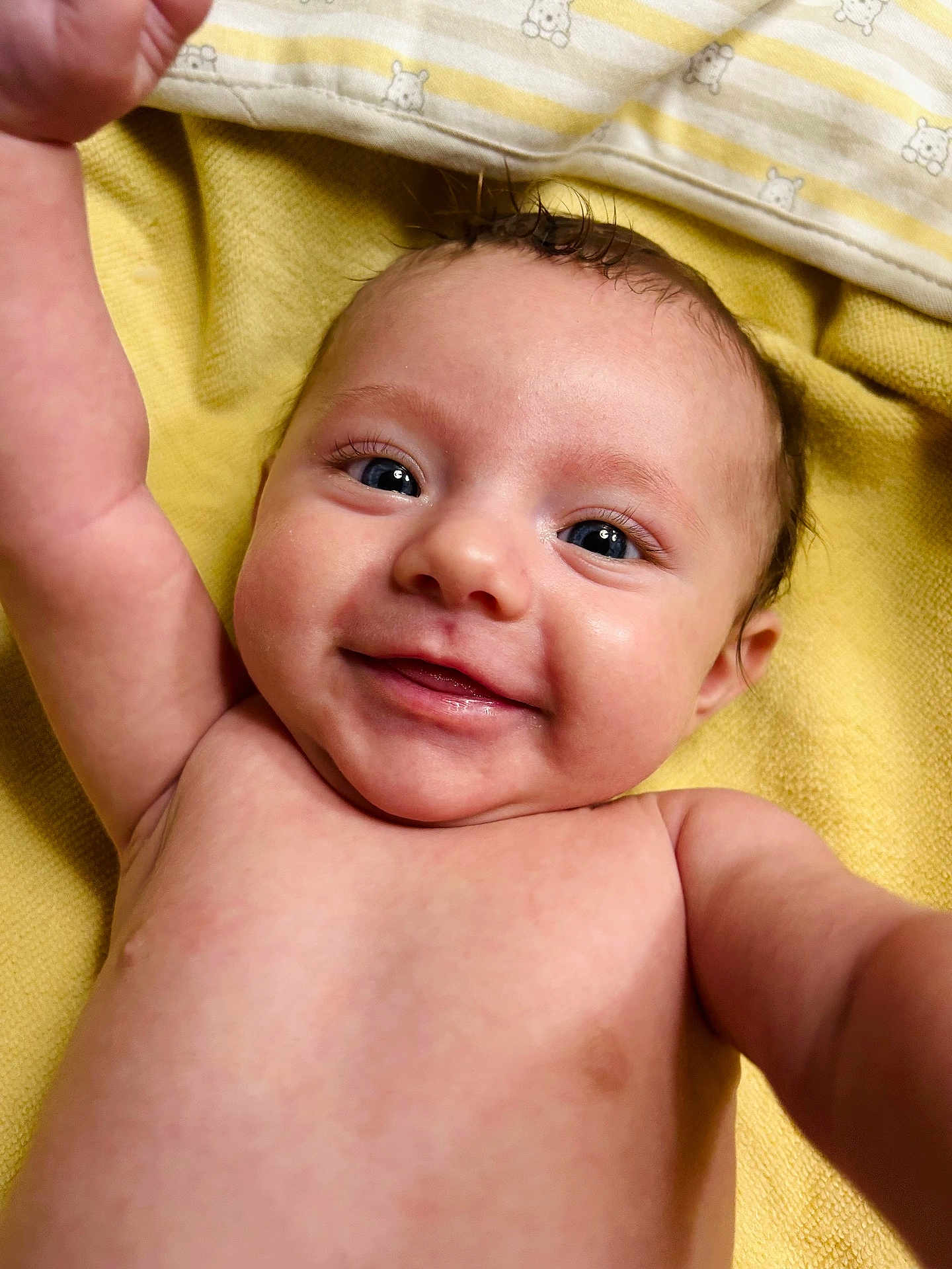 Mylee joined the competition — help win amazing prizes! baby, smiling, face, eyes, arm, skin, blanket, yellow, infant, happy, cute, child, portrait, closeup, lying_down, human, baby_skin, expression, newborn, baby_face