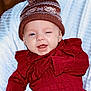 Mylee joined the competition — help win amazing prizes! baby, child, smiling, winking, knit_hat, red_sweater, cozy, blanket, portrait, cute, happy, infant, face, blue_eyes, indoors, warm_clothing, closeup, sitting, person, headwear