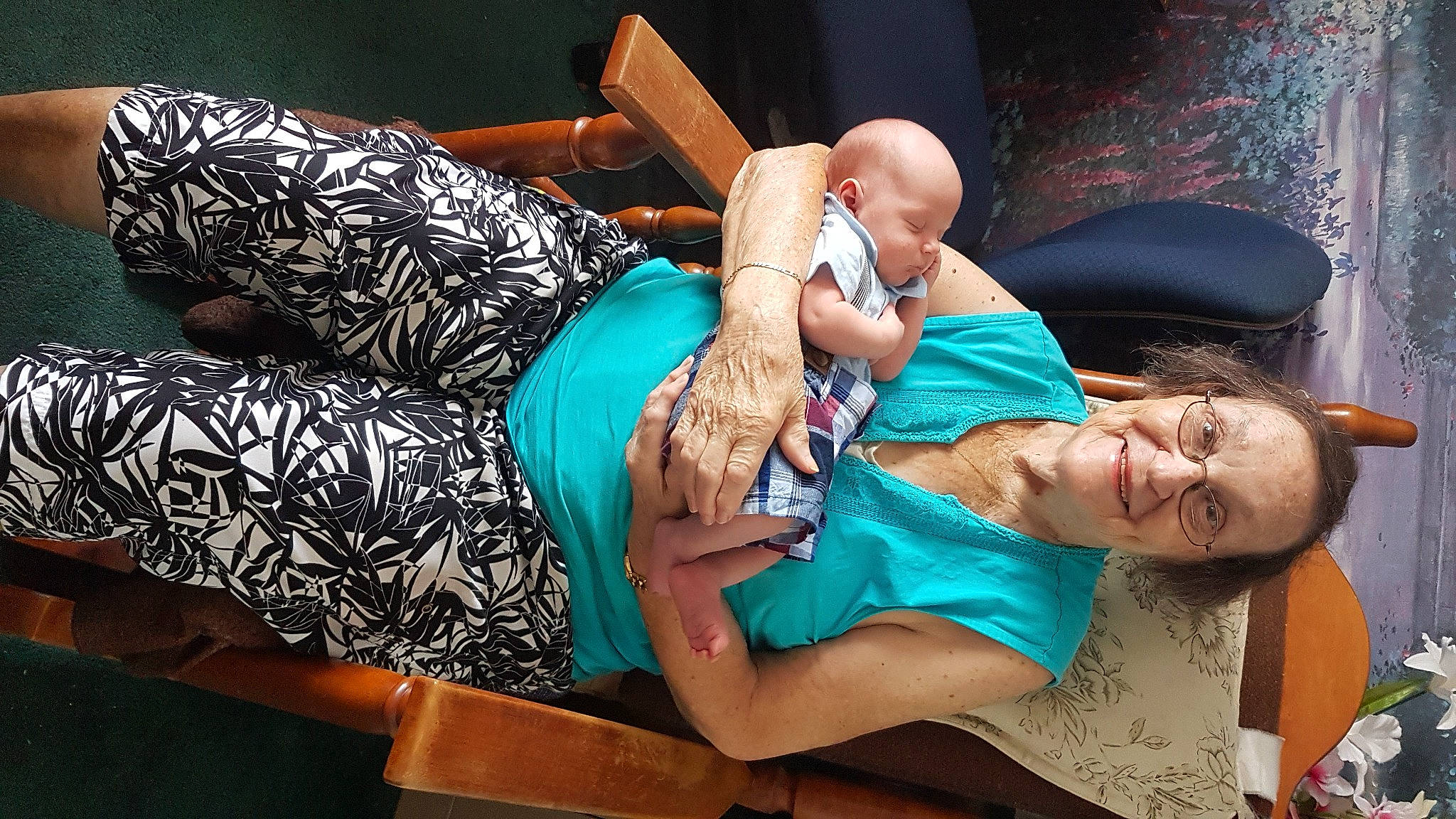 James is registered to the contest to win money with this photo: baby, child, comfort, couch, elbow, event, flash_photography, fun, happy, hat, interaction, joint, joy, leisure, muscle, person, purple, room, sitting, thigh