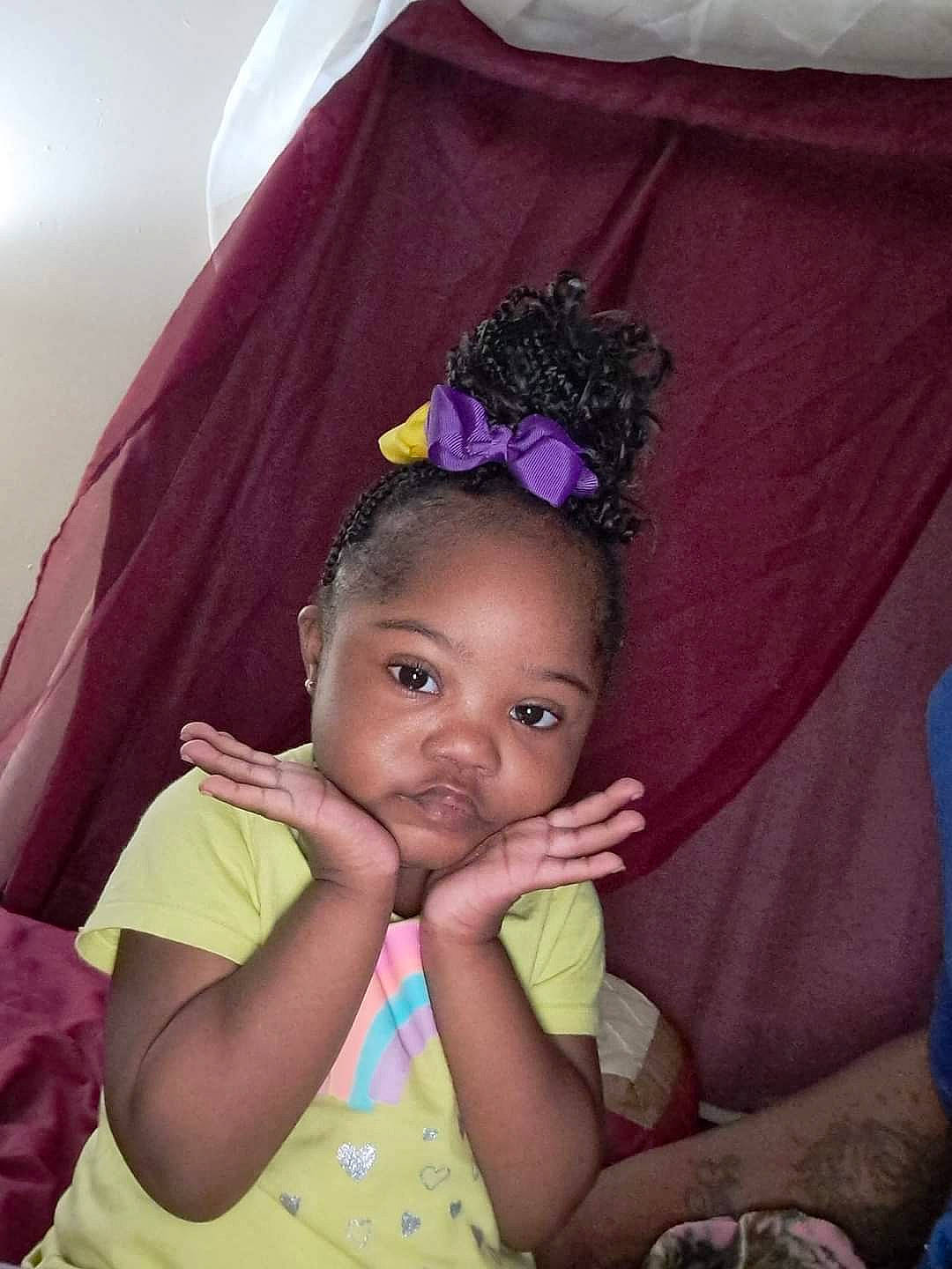 Ja'Riyah is registered to the contest to win money with this photo: black, black_hair, child, chin, costume_hat, eye, eyebrow, eyelash, face, fun, happy, head, iris, magenta, person, pink, purple, skin, textile, toddler