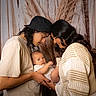 Atticus joined the competition — help win amazing prizes! baby, adult, family, portrait, love, intimacy, warm_lighting, curly_hair, knit_sweater, black_hat, indoor, closeup, head_together, gentle, caring, parenthood, soft_background, neutral_colors, people, toddler