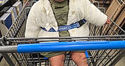 Lily joined the competition — help win amazing prizes! baby, shopping_cart, store, cardboard_boxes, coat, headband, boots, smiling, child, aisle, clothing, floor, metal, retail, person, happy, infant, seatbelt, shopping, indoor
