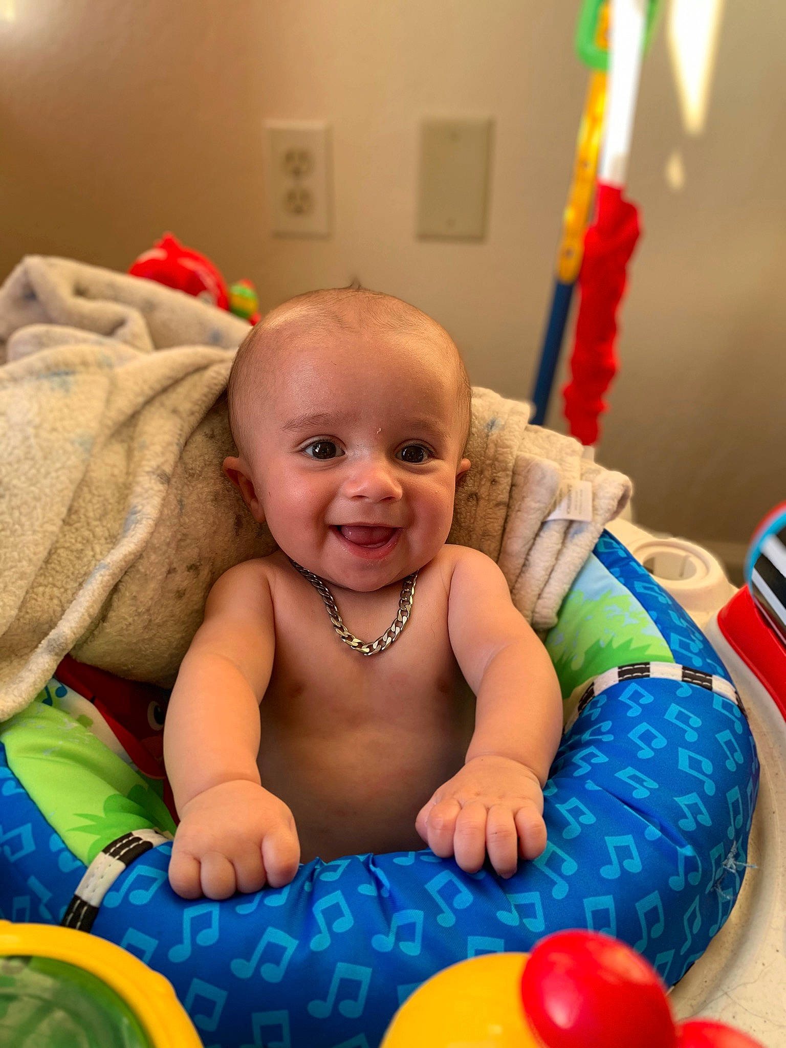 Atlas is registered to the contest to win money with this photo: baby, baby_playing_with_toys, cheek, child, face, facial_expression, fun, happy, head, iris, joy, leisure, mouth, people, person, photograph, product, skin, smile, textile