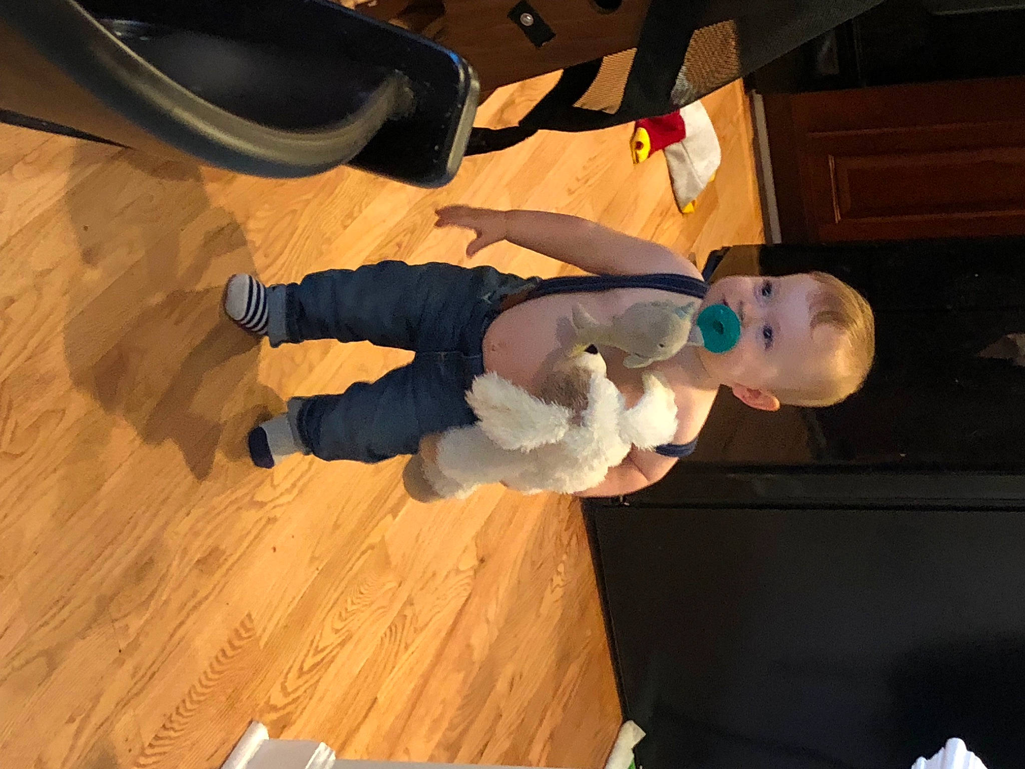 John is registered to the contest to win money with this photo: baby, baby_toddler_clothing, child, flooring, foot, fun, hardwood, human_leg, knee, laminate_flooring, person, plank, toddler, varnish, walking_shoe, wood, wood_flooring, wood_stain