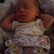 Adelia is registered to the contest to win money with this photo: newborn, baby, sleeping, blanket, floral_pattern, infant, cozy, soft, relaxed, peaceful, indoors, portrait, child, clothing, cute, resting, young, human, blanket_wrap, comfort