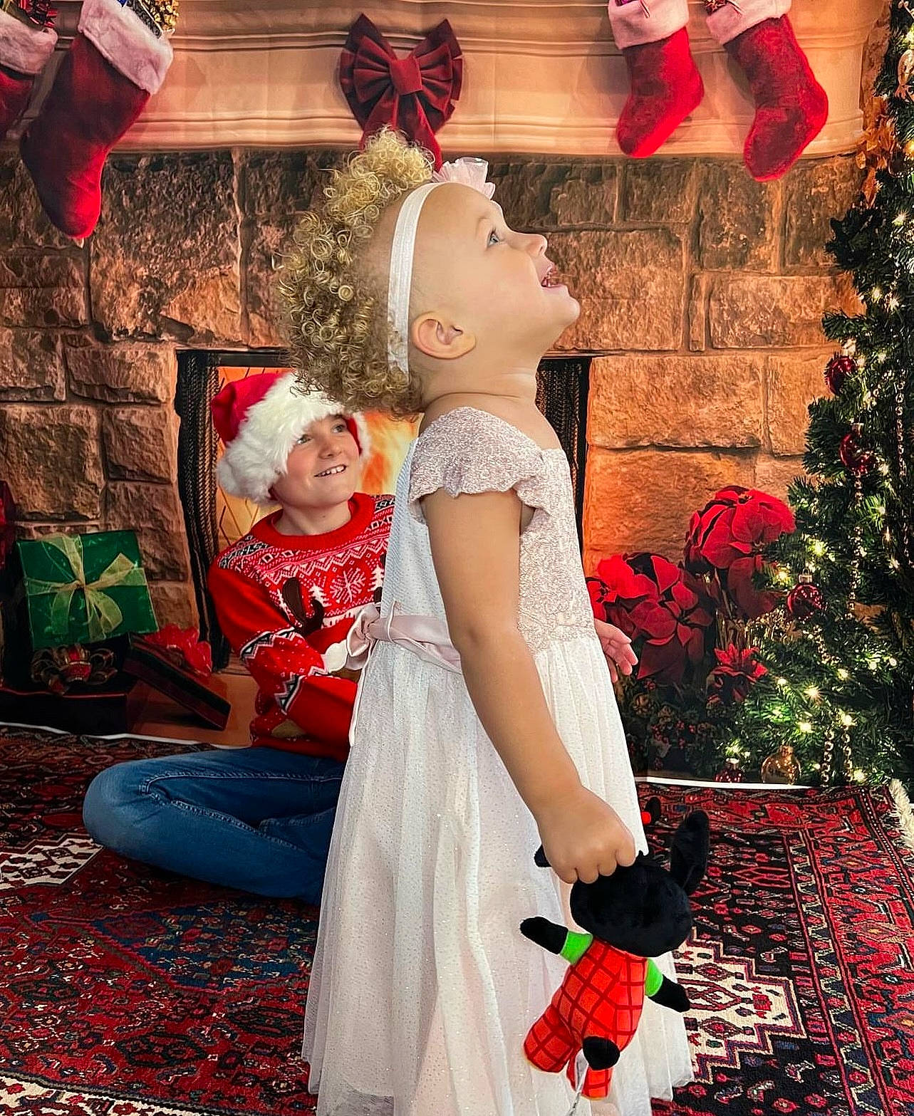 Kamari joined the competition — help win amazing prizes! child, christmas, christmas_decoration, christmas_eve, christmas_ornament, christmas_tree, event, fashion_design, formal_wear, fun, happy, hat, headwear, holiday, joy, ornament, people_in_nature, person, petal, plant