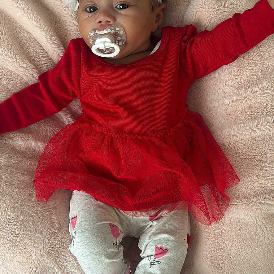 Rimya joined the competition — help win amazing prizes! baby, bodypart, bonnet, cap, clothing, costume, face, finger, footwear, hand, happy, hat, head, pants, person, photography, portrait, shoe, sitting, smile