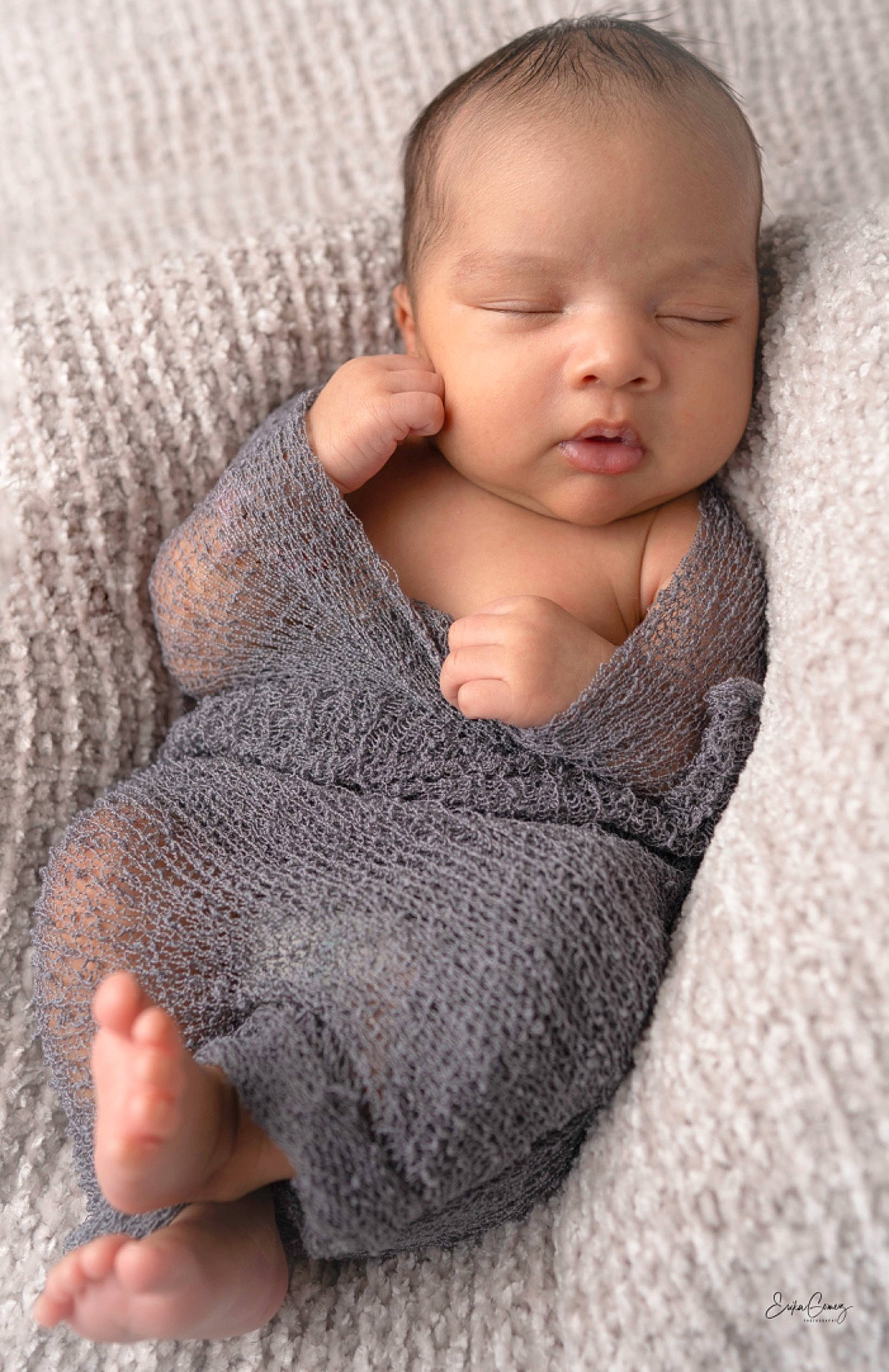 Michael is registered to the contest to win money with this photo: arm, baby_toddler_clothing, cheek, chin, comfort, eye, face, finger, gesture, grey, hair, human_body, iris, joint, lip, neck, nose, person, skin, sleeve