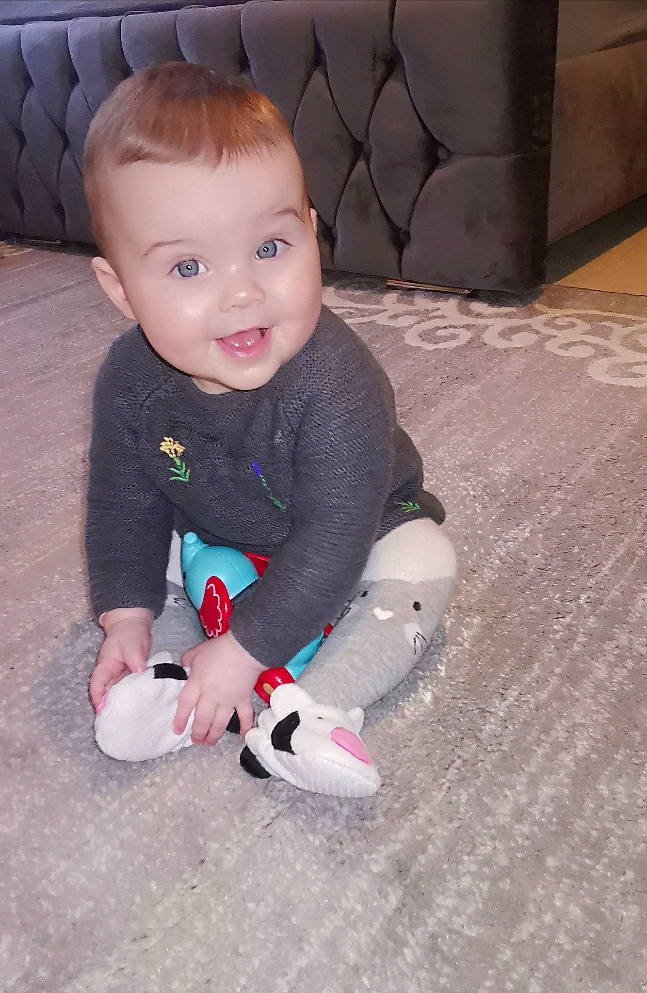 Alissa is registered to the contest to win money with this photo: baby, baby_toddler_clothing, cheek, child, comfort, eye, face, floor, flooring, fun, head, iris, leg, person, pink, sitting, skin, sleeve, smile, toddler