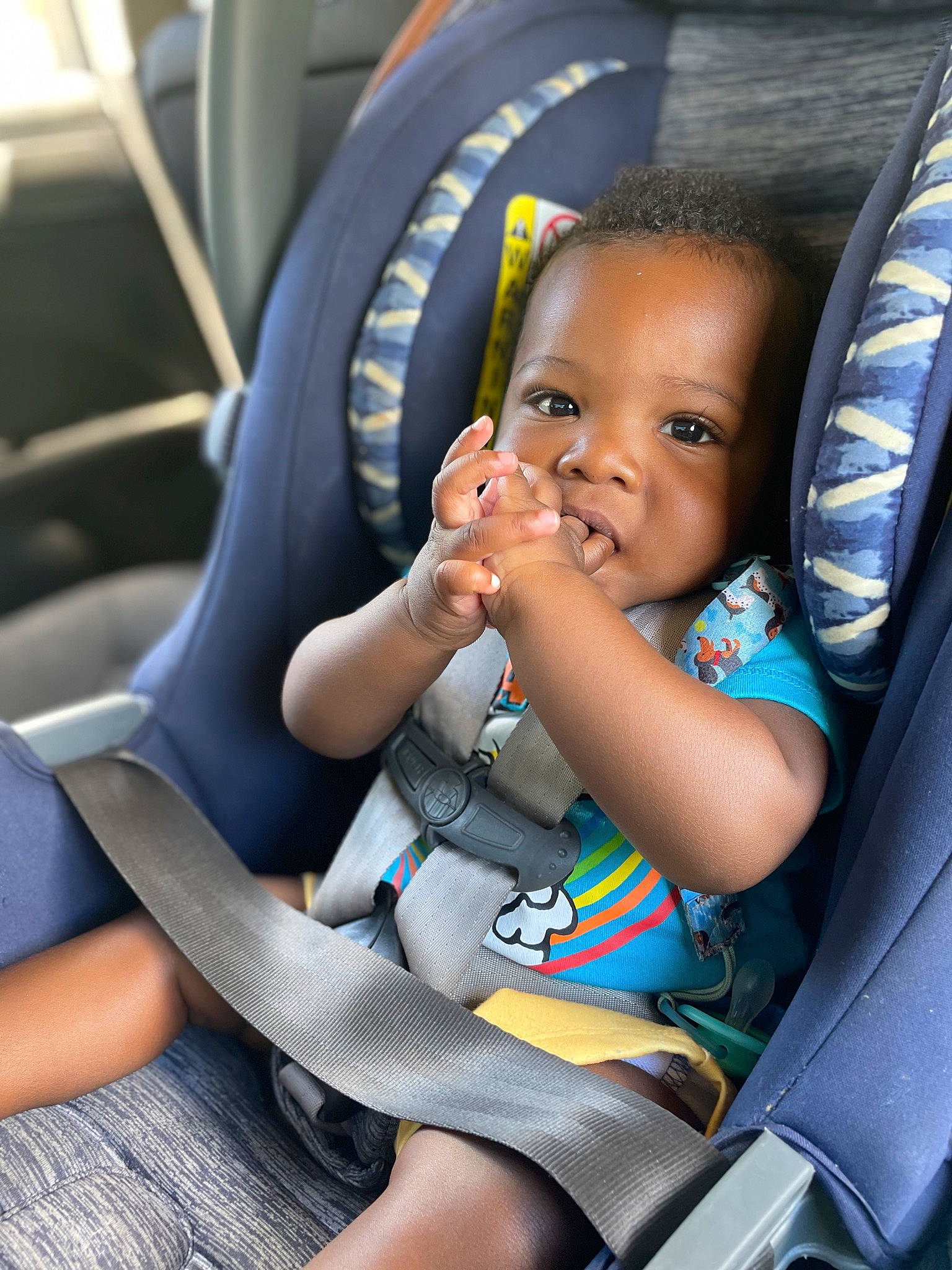 Roderick is registered to the contest to win money with this photo: auto_part, automotive_design, baby, baby_in_car_seat, blue, car, car_seat, car_seat_cover, child, comfort, family_car, head_restraint, mode_of_transport, motor_vehicle, person, seat_belt, steering_part, steering_wheel, toddler, vehicle