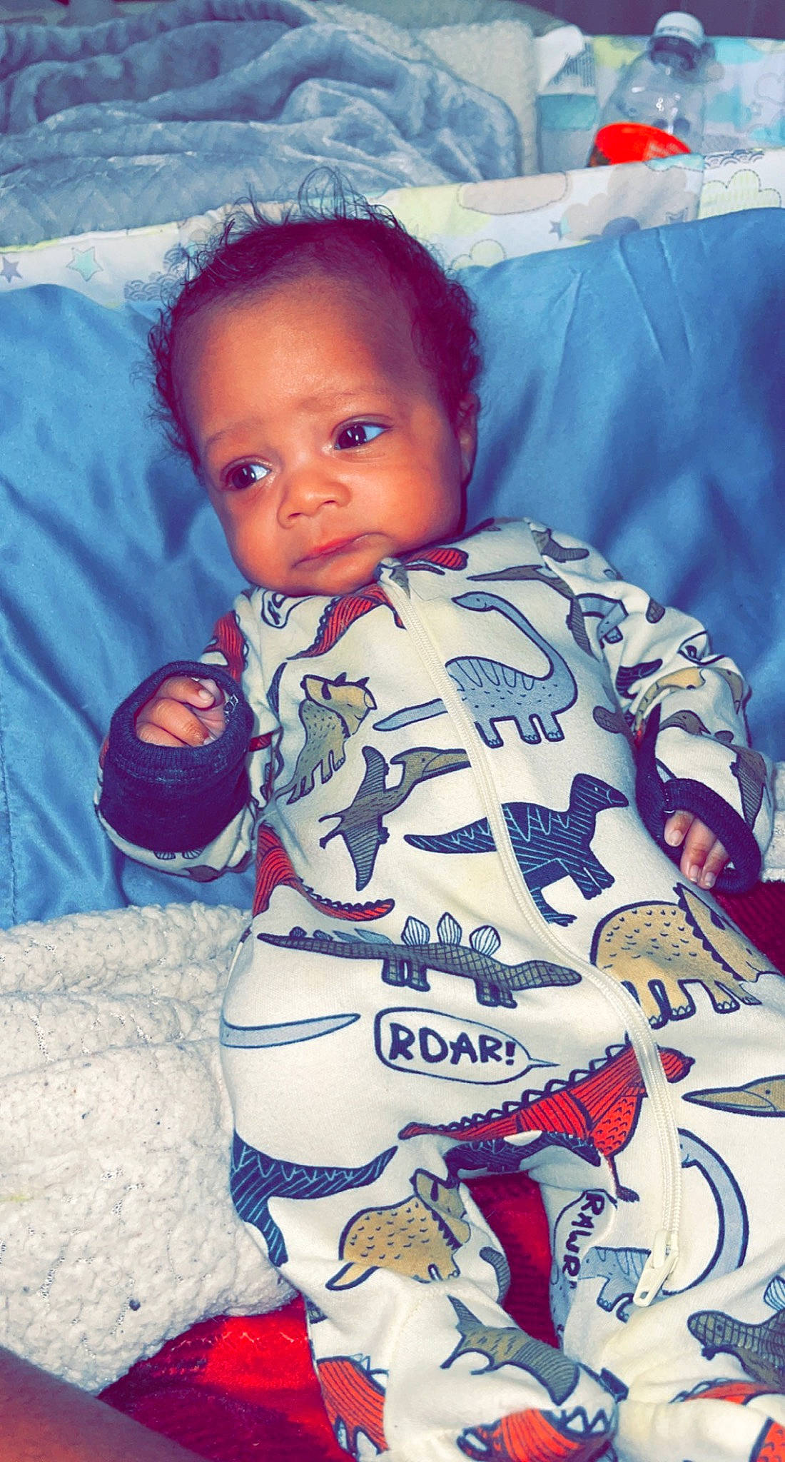 Celestino Betance is registered to the contest to win money with this photo: baby, baby_toddler_clothing, ball, blue, cheek, child, cool, flooring, fun, hairstyle, happy, linens, mouth, pattern, person, play, product, sitting, sleeve, t_shirt